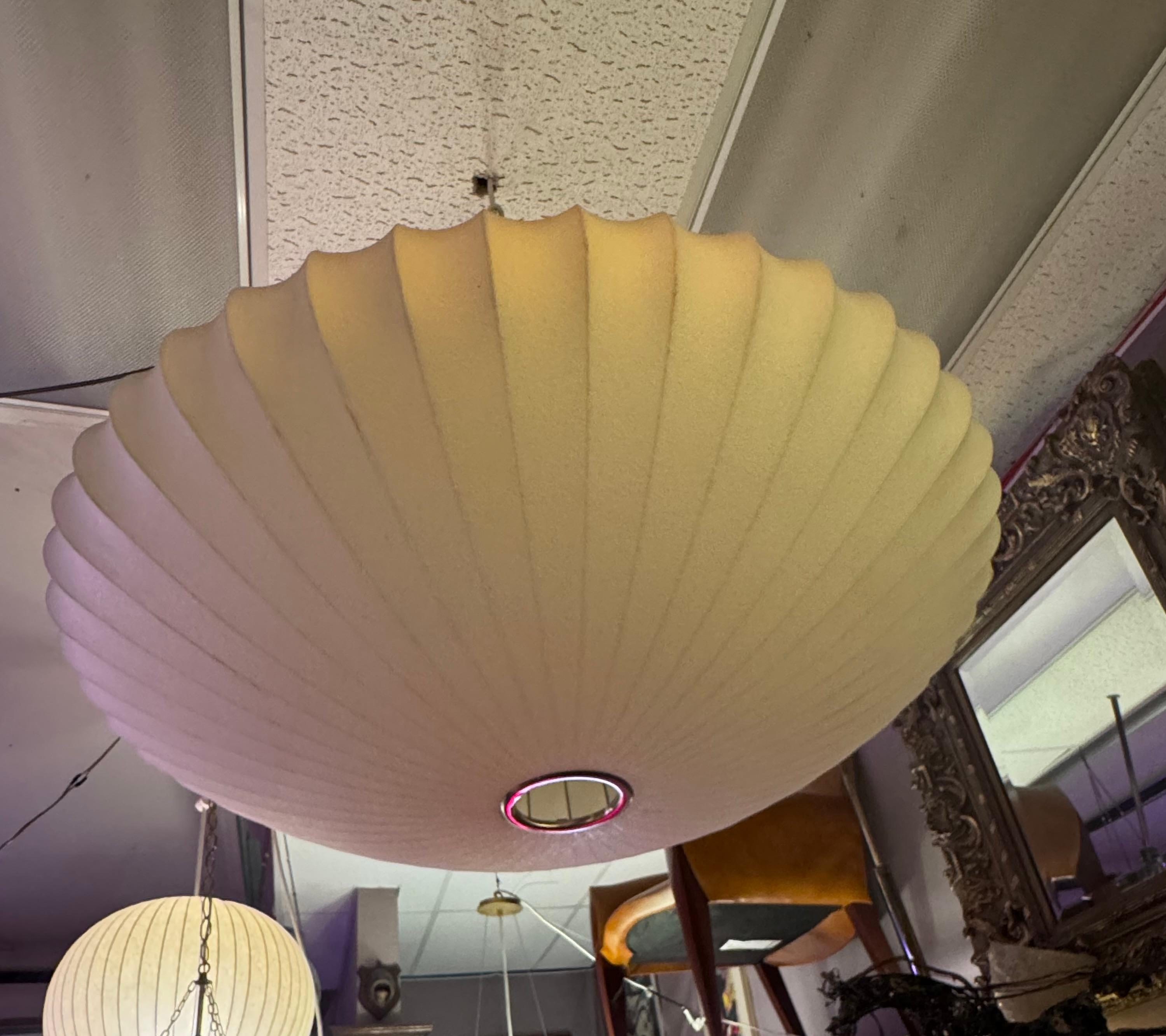 Mid Century Modern George Nelson Style Large Atomic Hanging Saucer Bubble Lamp

George Nelson designed the first bubble lamps in 1947. These lamps, with their simple sculptural shapes, were constructed of an innovative taut plastic that coated a