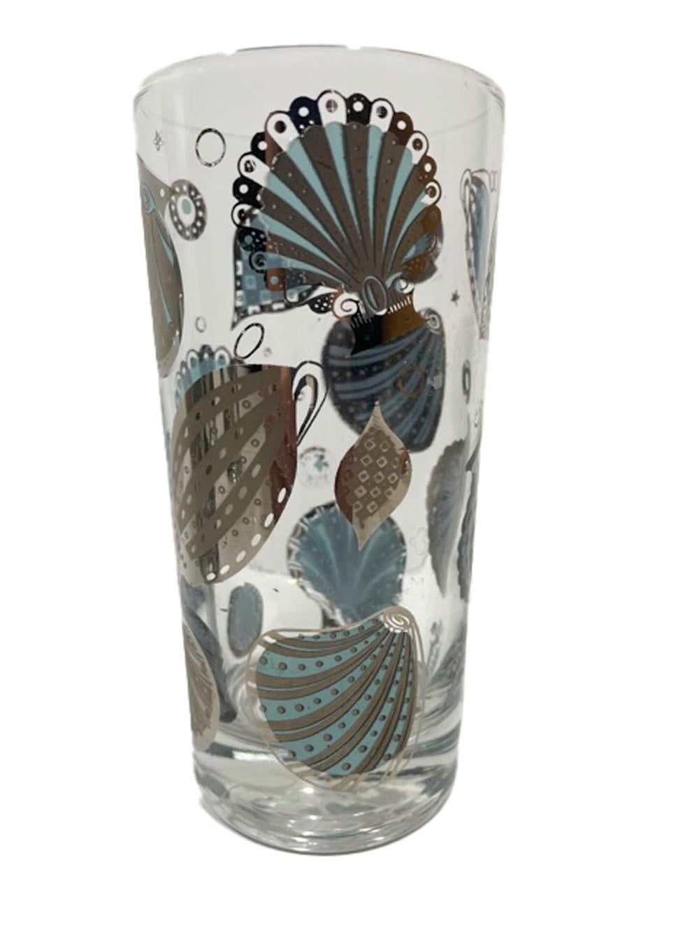 Set of 6 vintage highball glasses in the silver version of the Seascape pattern by Georges Briard, having a variety of seashells on the exterior in silver over blue enamel with just small accents of the blue visible on the exterior, the interior of