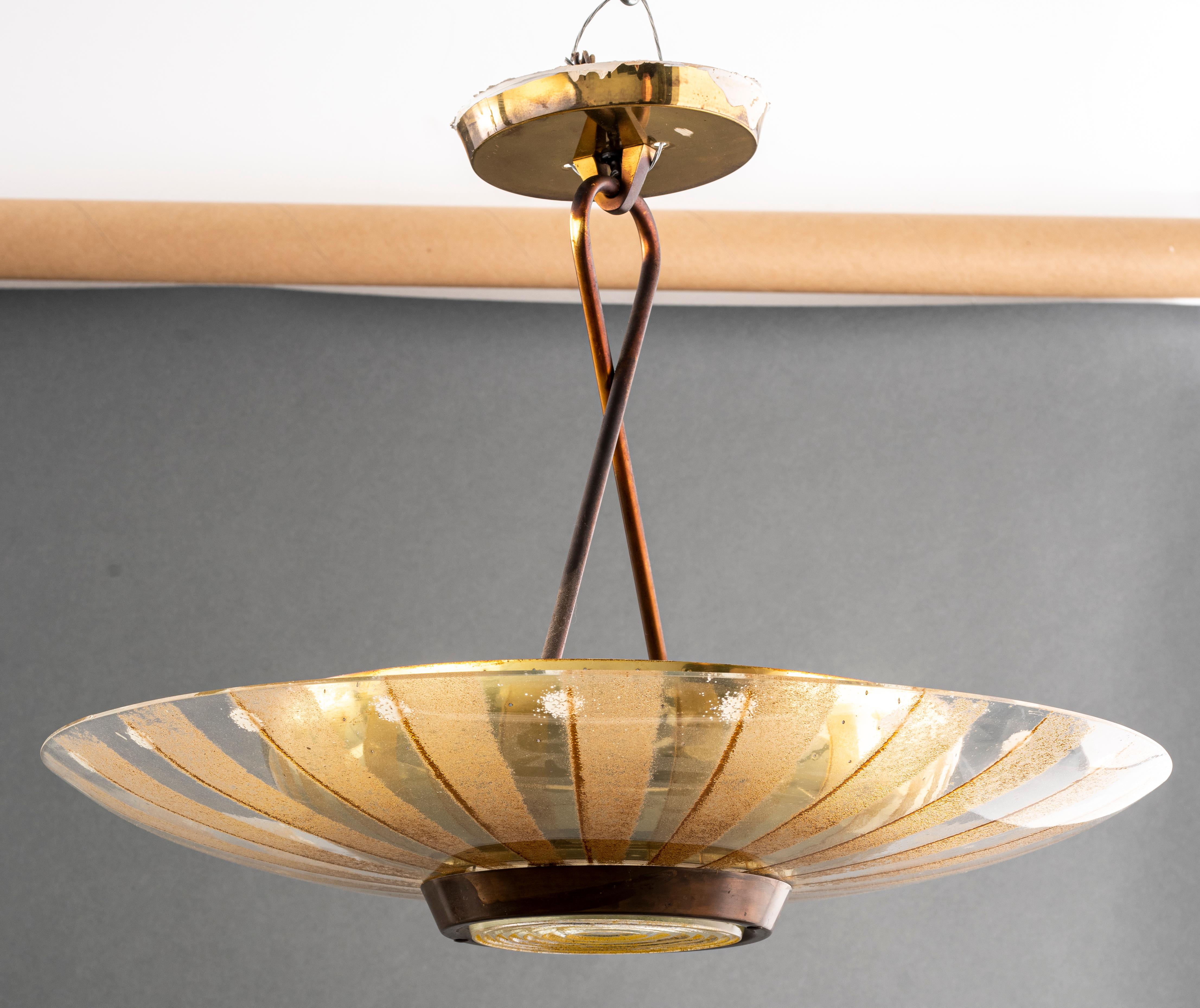 Mid-Century Modern glass chandelier with gilt details by Gerald Thurston for Lightolier, circa 1960. 19.5” height x 23.5” diameter.