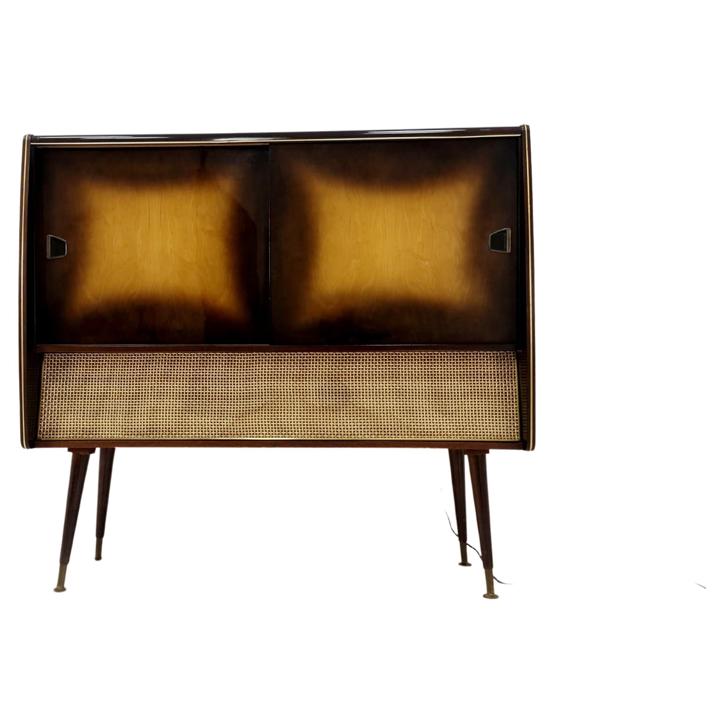 Mid Century Modern German record player, radio by Siemens , 1950s

The radio is in fully functional. 

Dimensions: 
43   D x 120 W x 111  H

It is in good vintage condition, however, as with all vintage items some minor wear marks should be