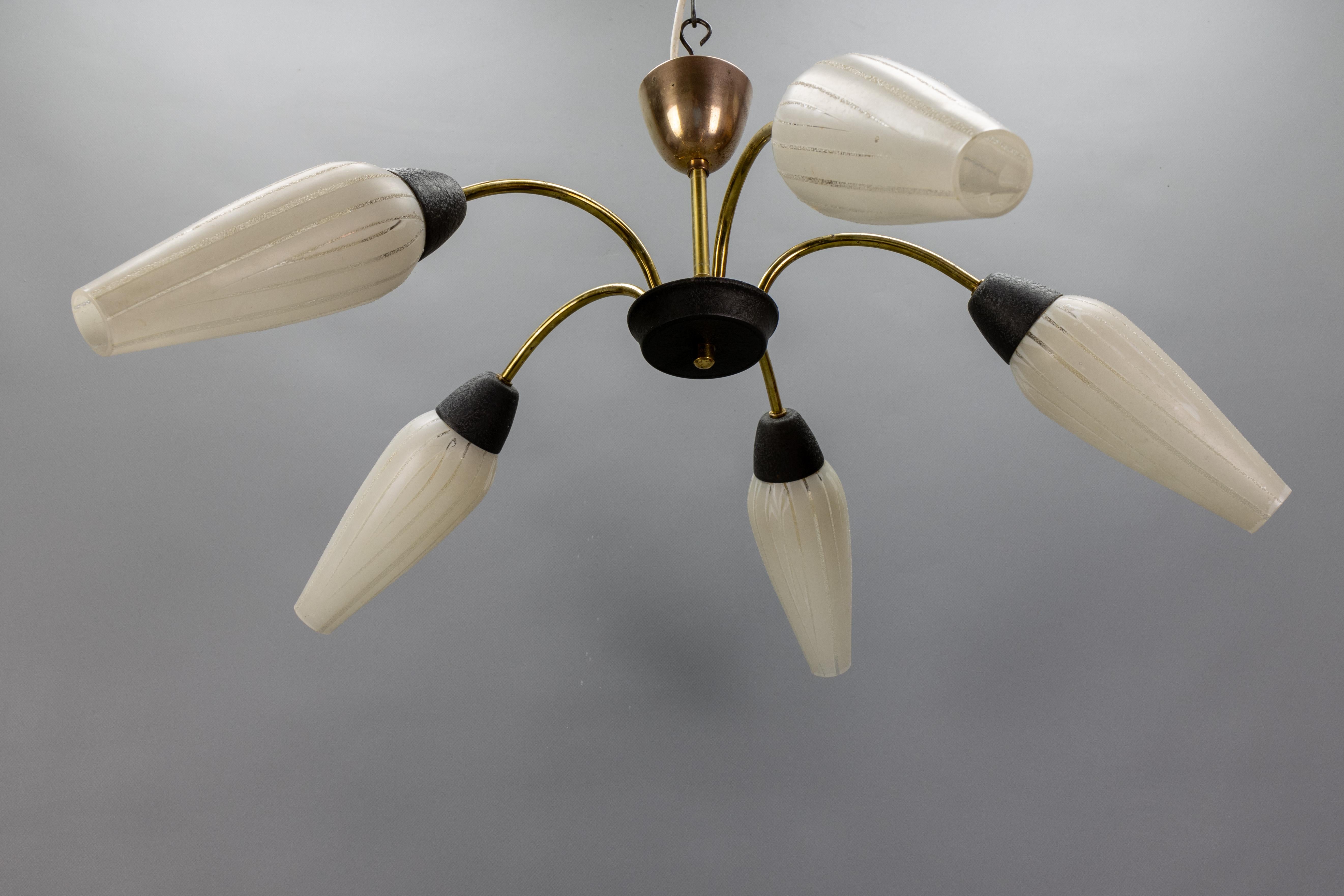 Mid-Century Modern Brass and White Glass Five-Light Sputnik Chandelier, Germany, circa 1950s
A striking example of mid-century German design, this Sputnik-style chandelier features five elegantly arched arms in polished brass radiating from a