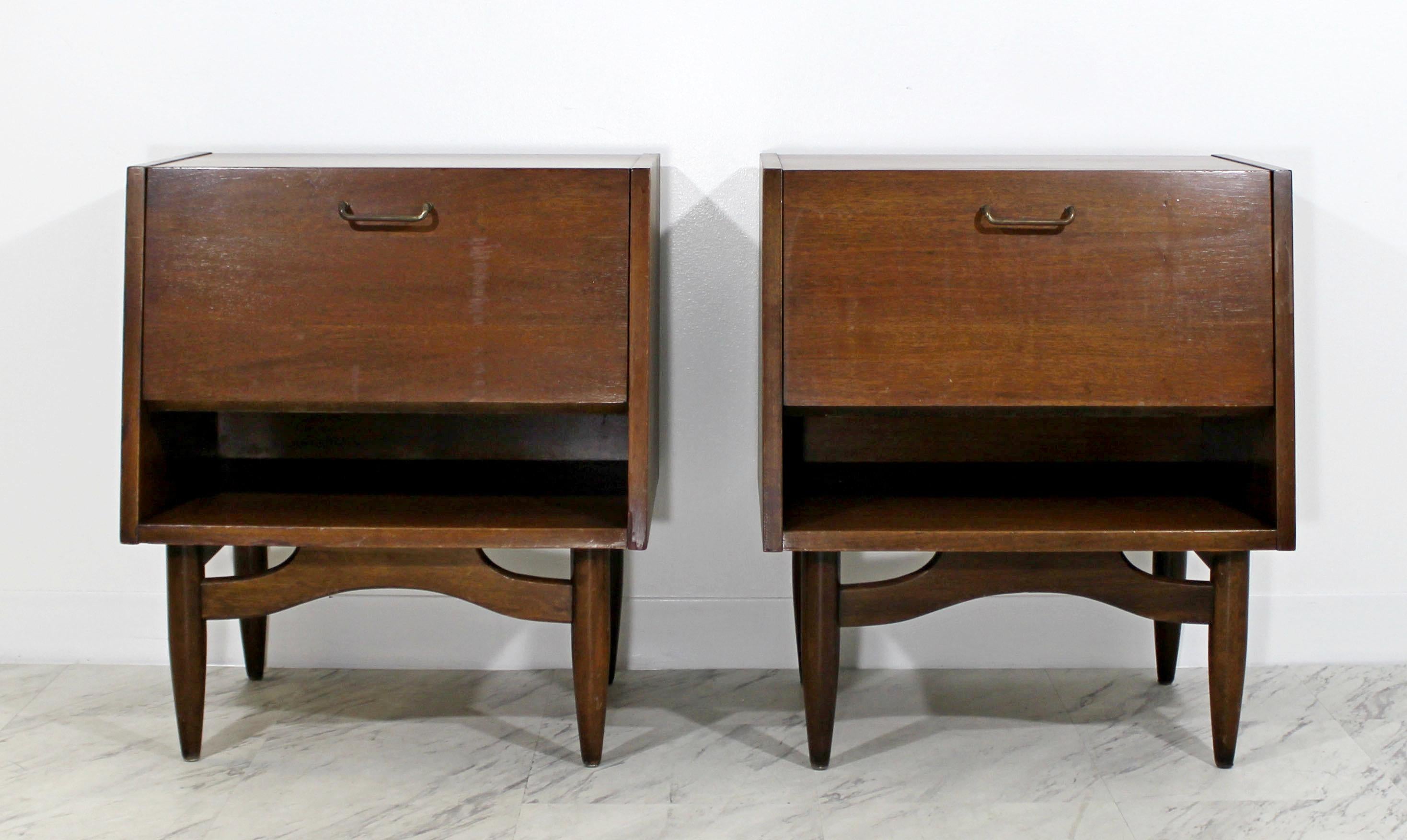 For your consideration is a marvellous pair of walnut nightstands, with one drawer each and a drop down front, by Merton Gershun for American of Martinsville, circa 1950s. In very good condition. The dimensions of each are 22