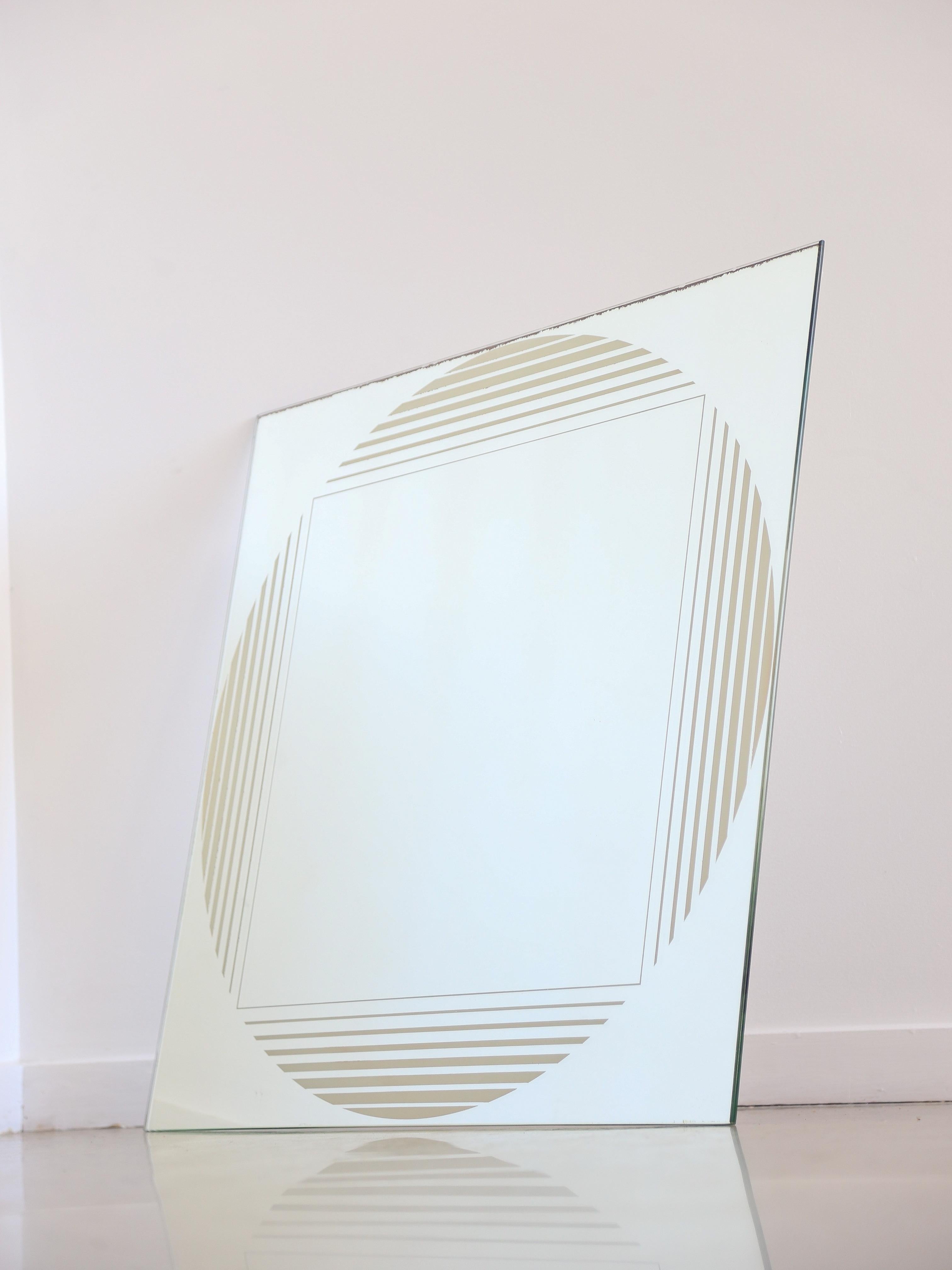 Gianni Celada for Fontana Arte wall mirror. 
Wall mirror by Gianni Celada for Fontana Arte, designed in '70s. The mirror has a screen printed decoration, geometrical silver theme.
Published in: L. Falconi, 