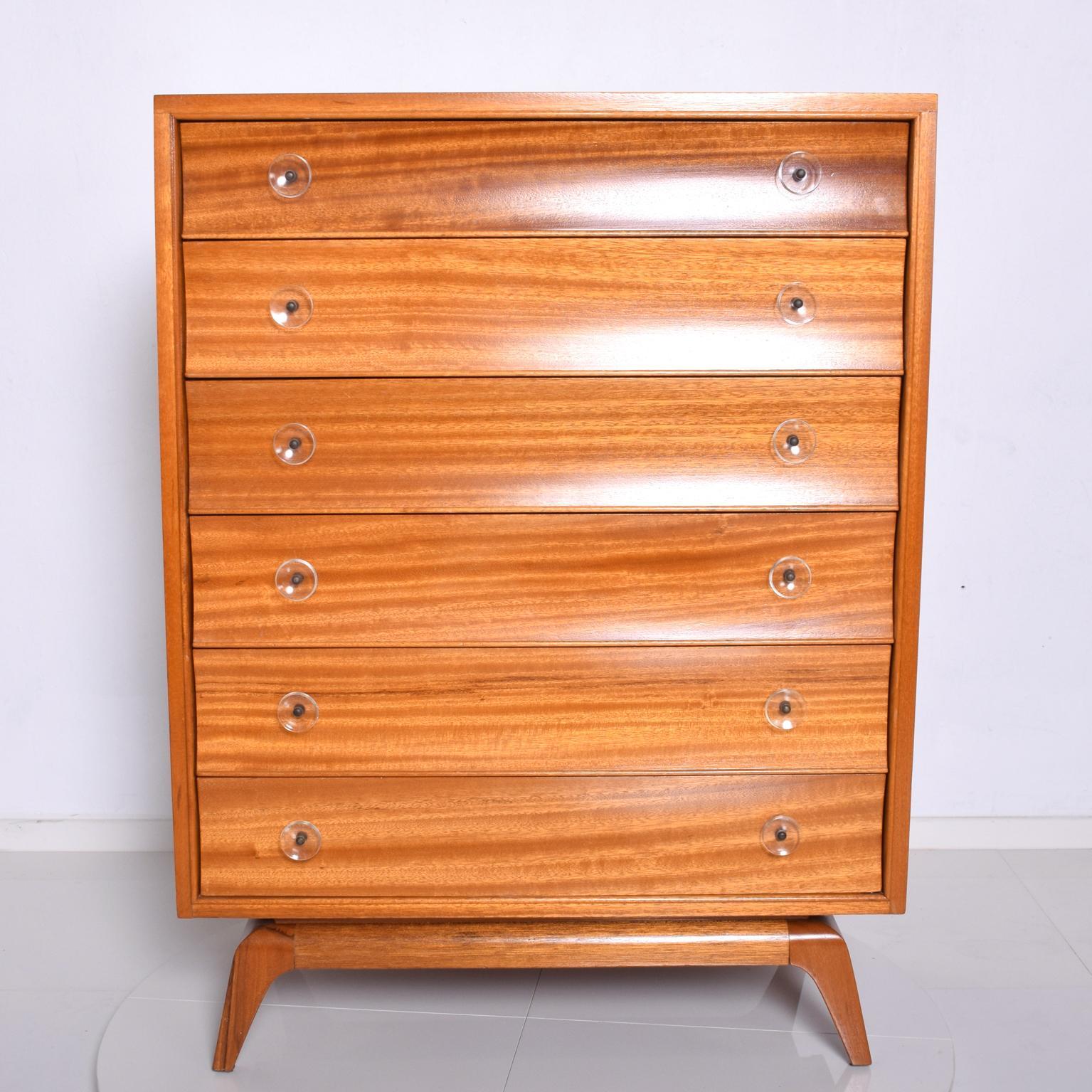 Gilbert Rohde Rare Art Deco Dresser in Sapele Wood with Lucite Pulls And Sculptural Flared Legs.
Sweet Simplicity & Elegance all in one. 
Dimensions are: 47