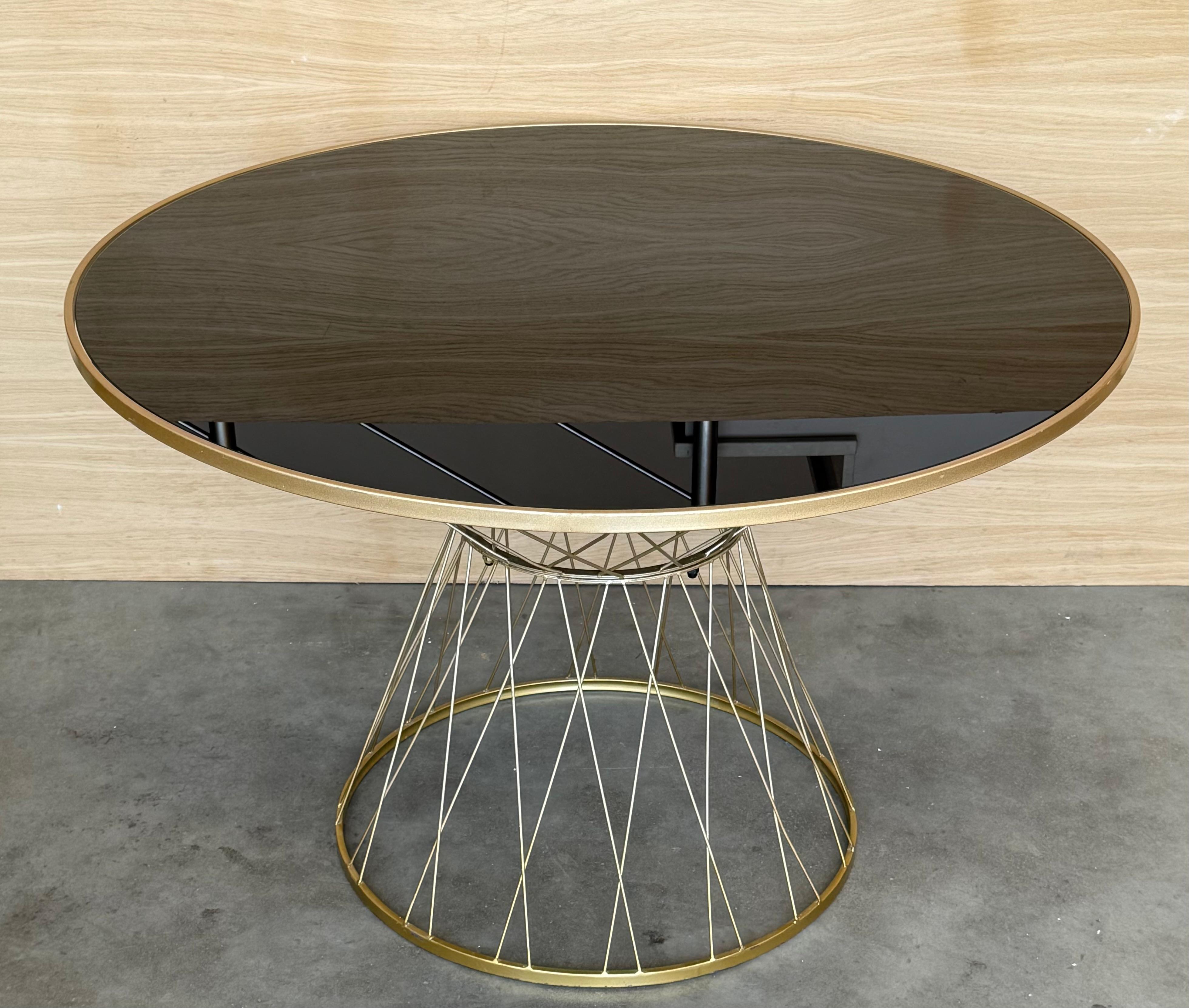 Spanish Mid Century Modern Gilded Allure Style Round Dining Table with Black Glass For Sale