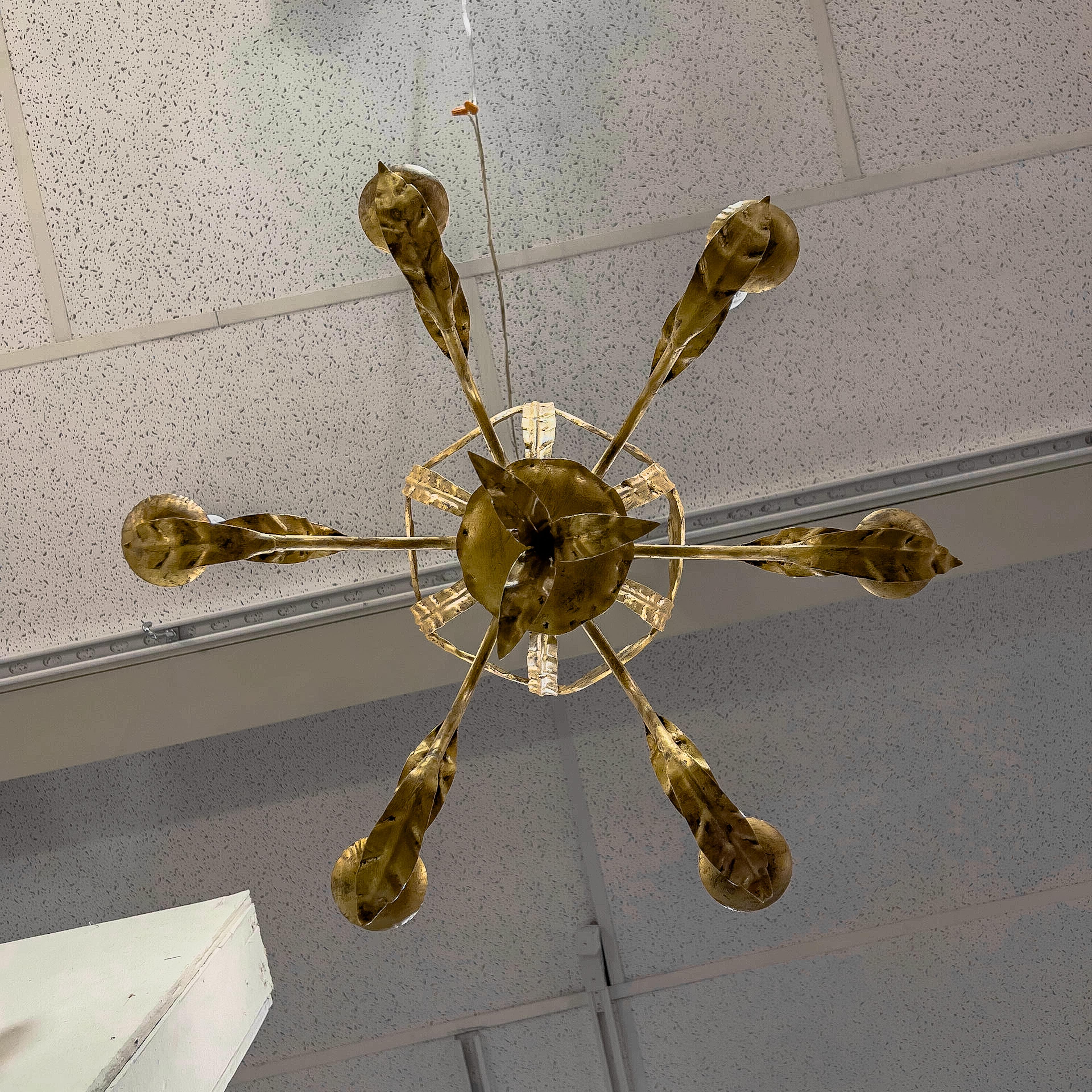 Mid-Century Modern Gilded Italian tole chandelier with an open carriage, swag and acanthus leaf detail.