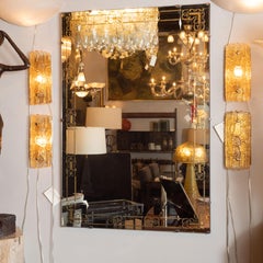 Mid-Century Modern Gilt Églomisé Floating Mirror with Stylized Arabesque Details