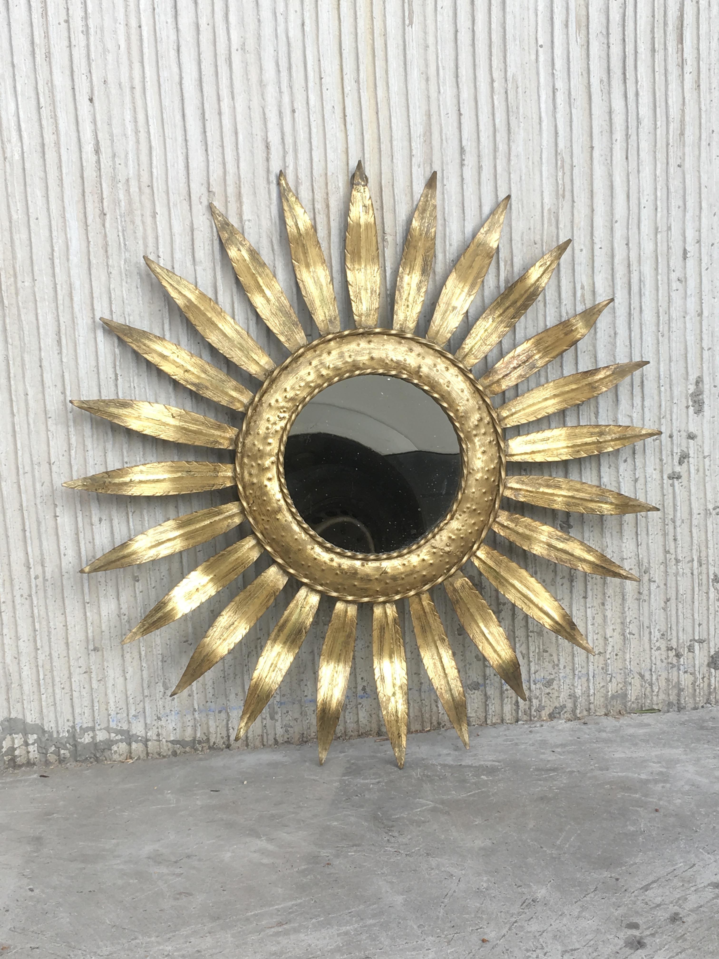 Mid-Century Modern gilt iron layered leafed flower shaped sunburst mirror.