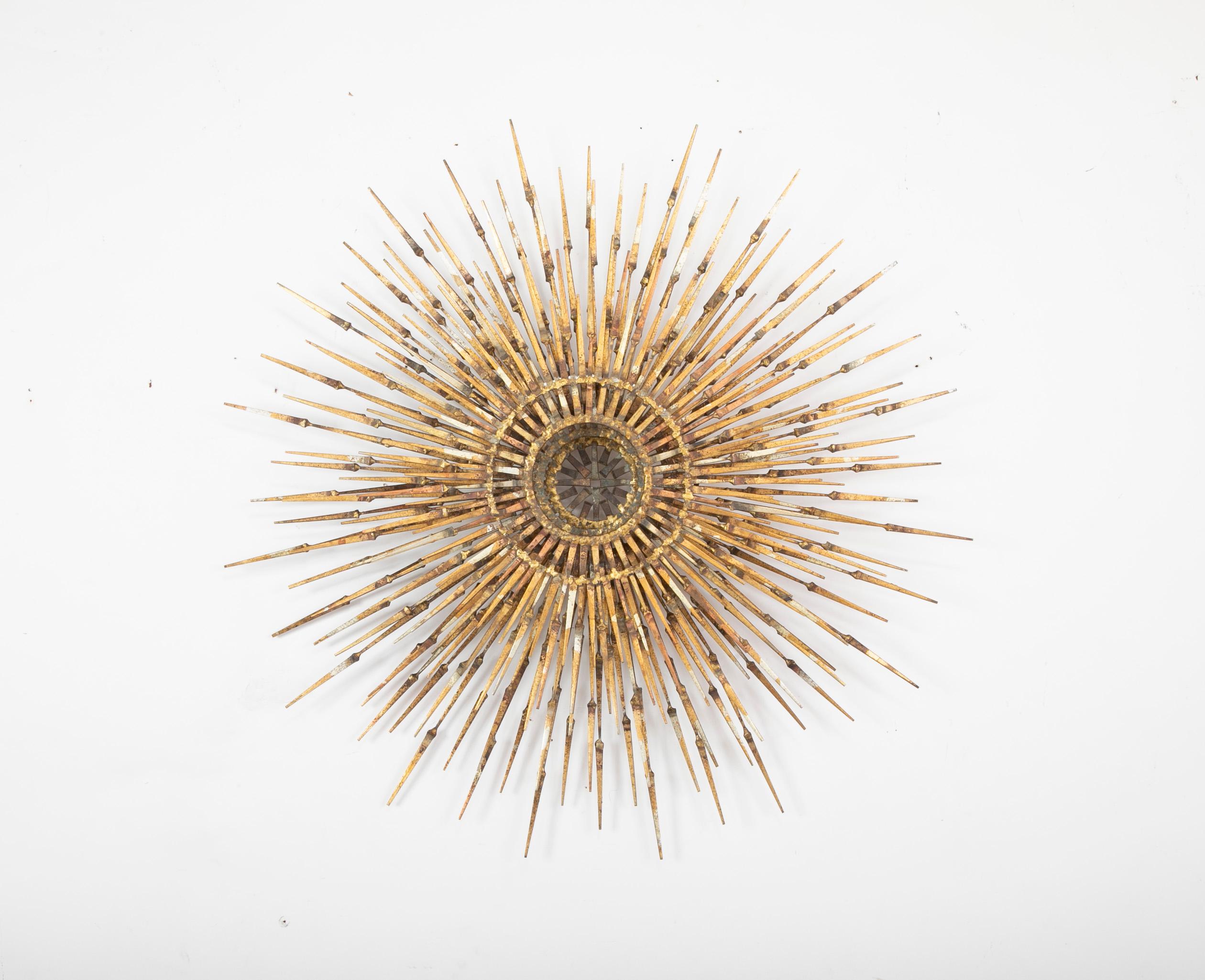 Impressive three tier gilt iron starburst wall mounted sculpture in the Brutalist style. Likely created by William Bowie, American circa 1970, though unsigned. Truly a living piece of sculpture, a Nova exploding perpetually on your wall.
Check out