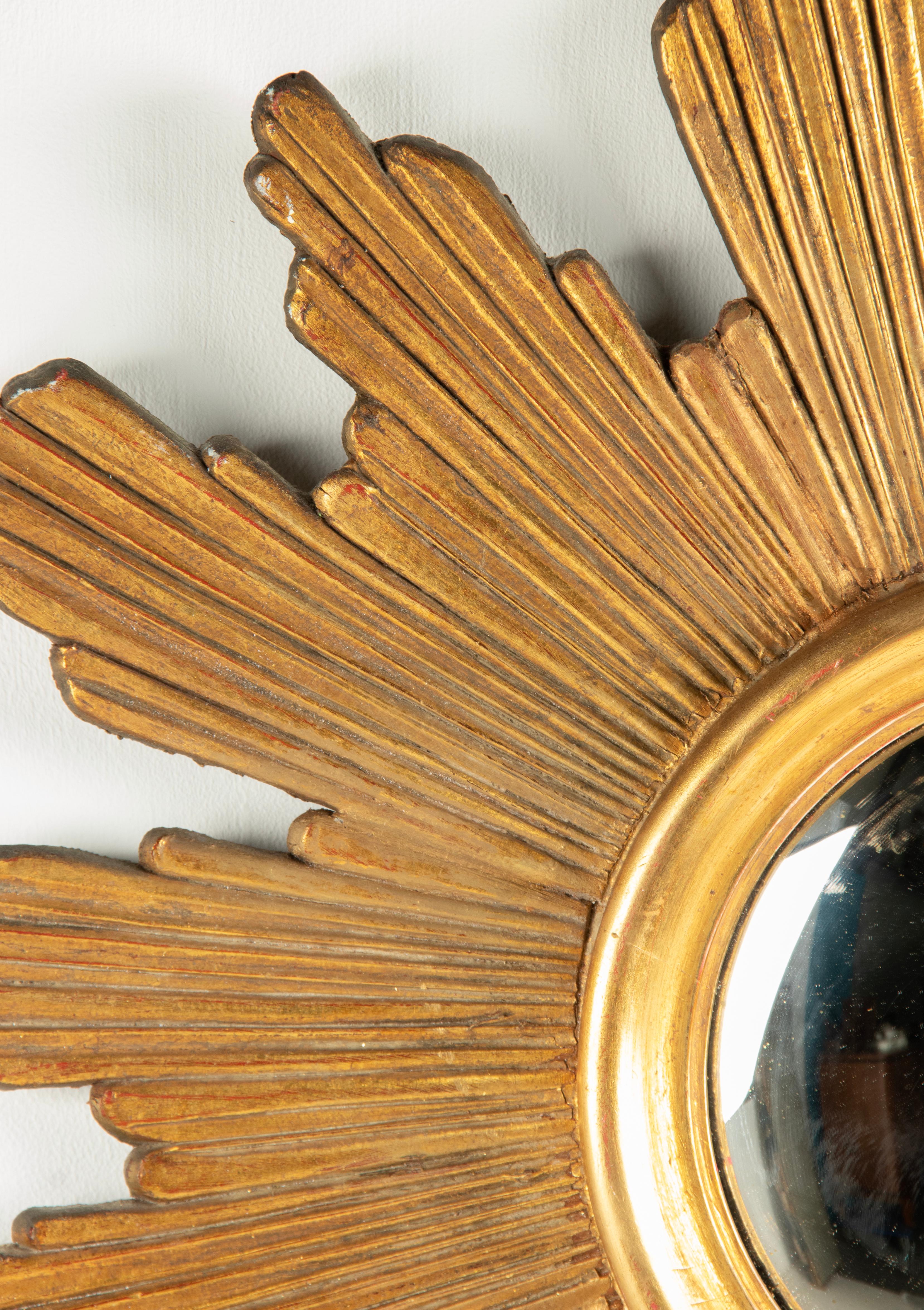French Mid-Century Modern Giltwood Carved Convex Sunburst Mirror For Sale