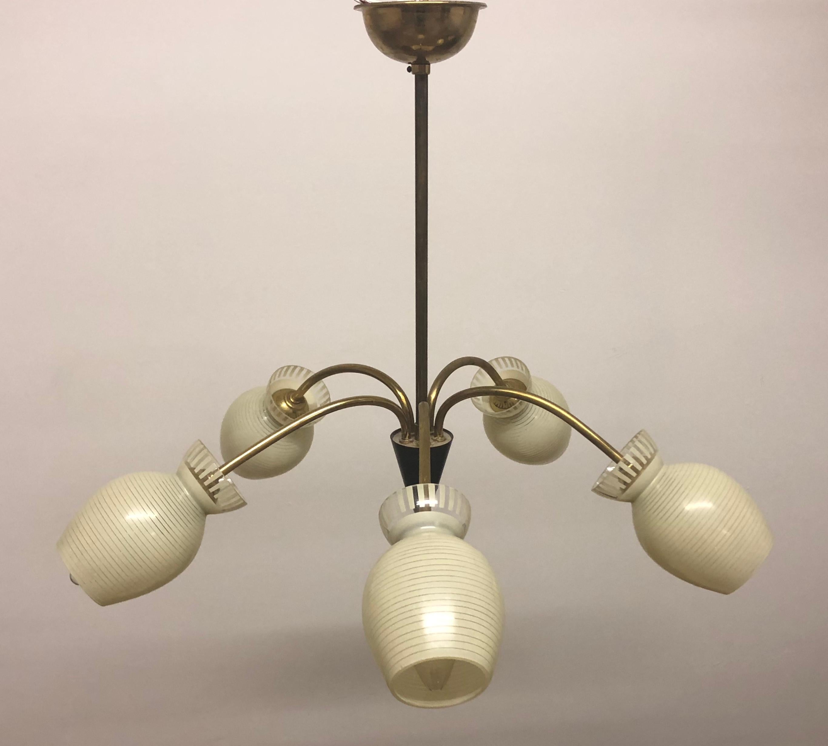 Fine, elegant Mid-Century Modern Sputnik chandelier, Germany, circa 1950s.
This chandelier is made of  brass frame and glass tubes.
Socket: Five Edison (e14) for standard screw bulbs.
Very good condition.