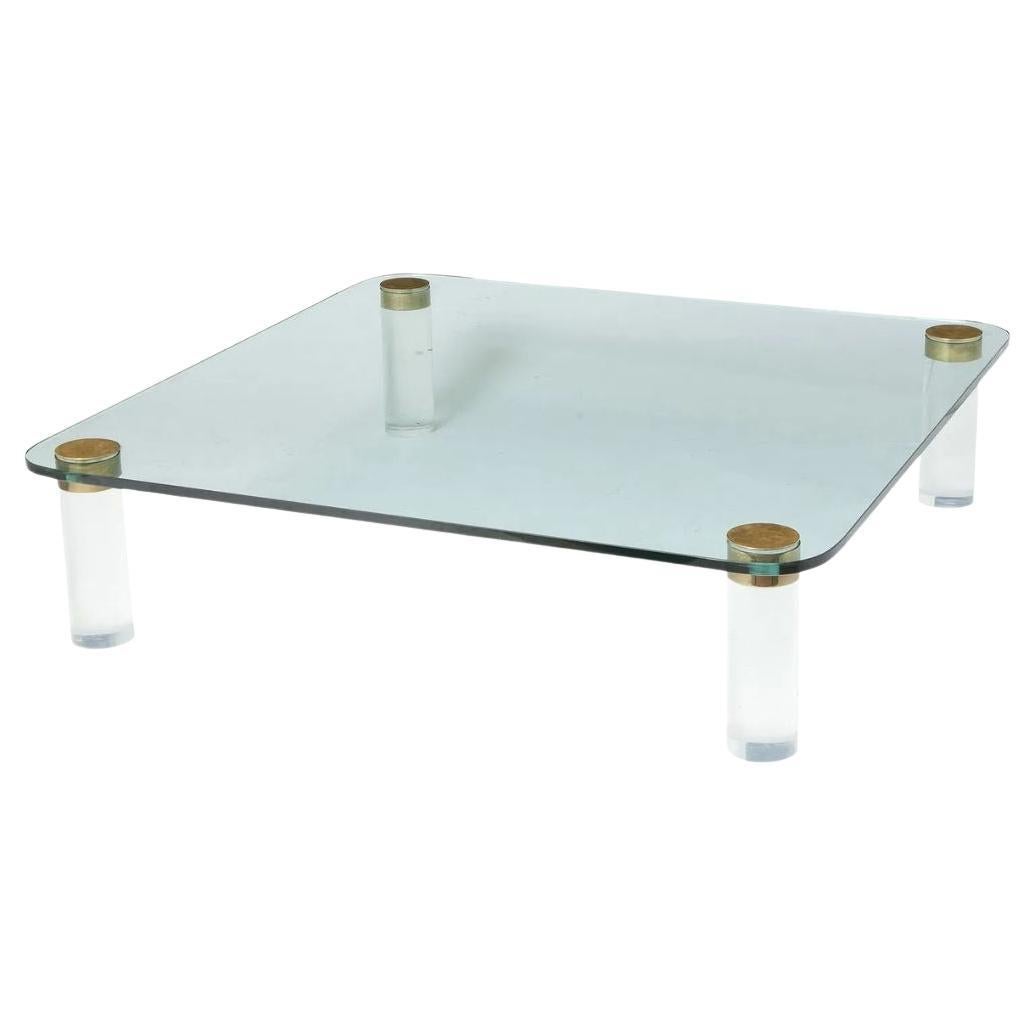 Table basse en verre et lucite en vente