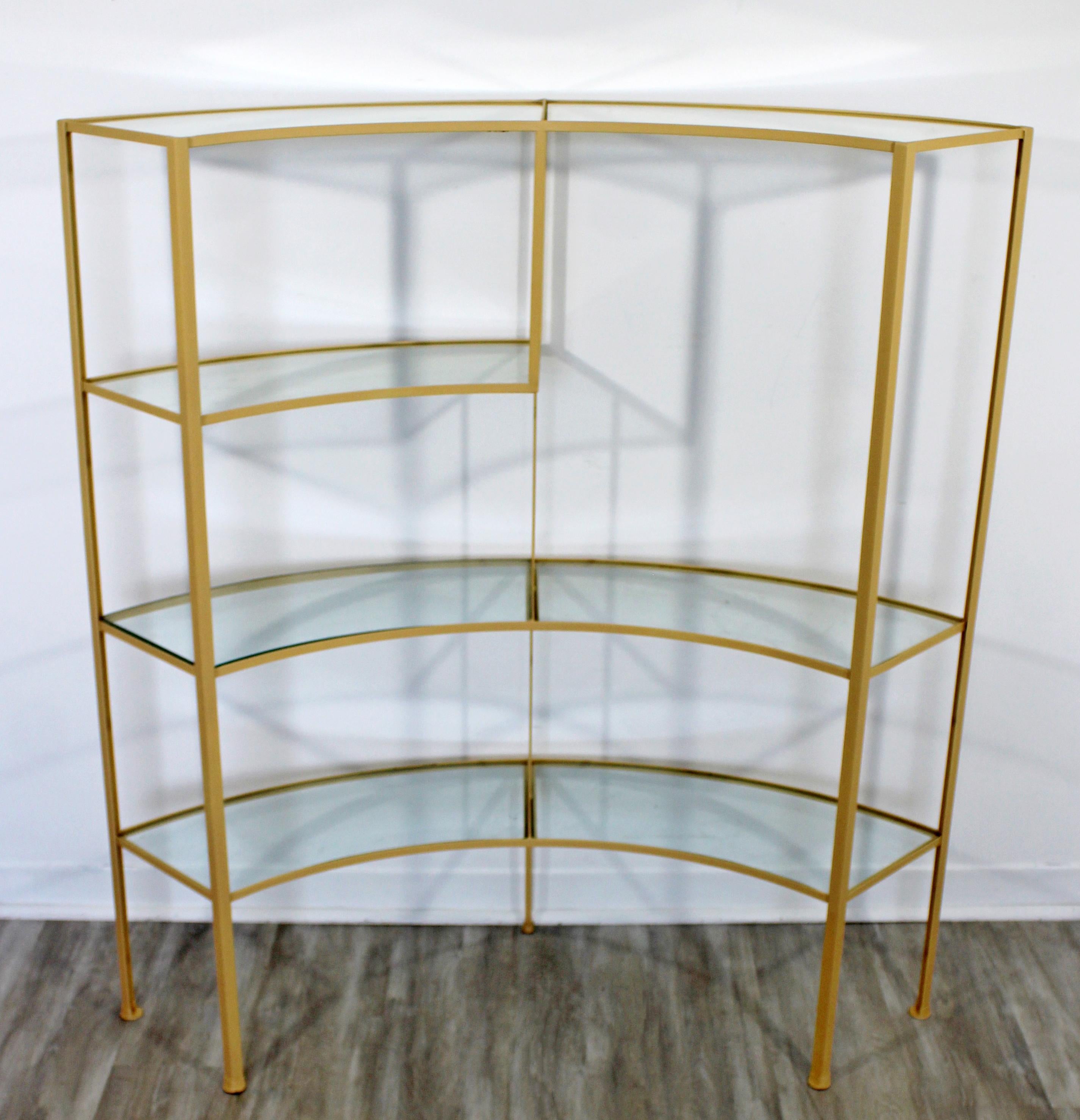For your consideration is a sculptural, wrought iron étagère with seven glass shelves, by Frederick Weinberg, circa 1950s. In very good vintage condition. The dimensions are 47