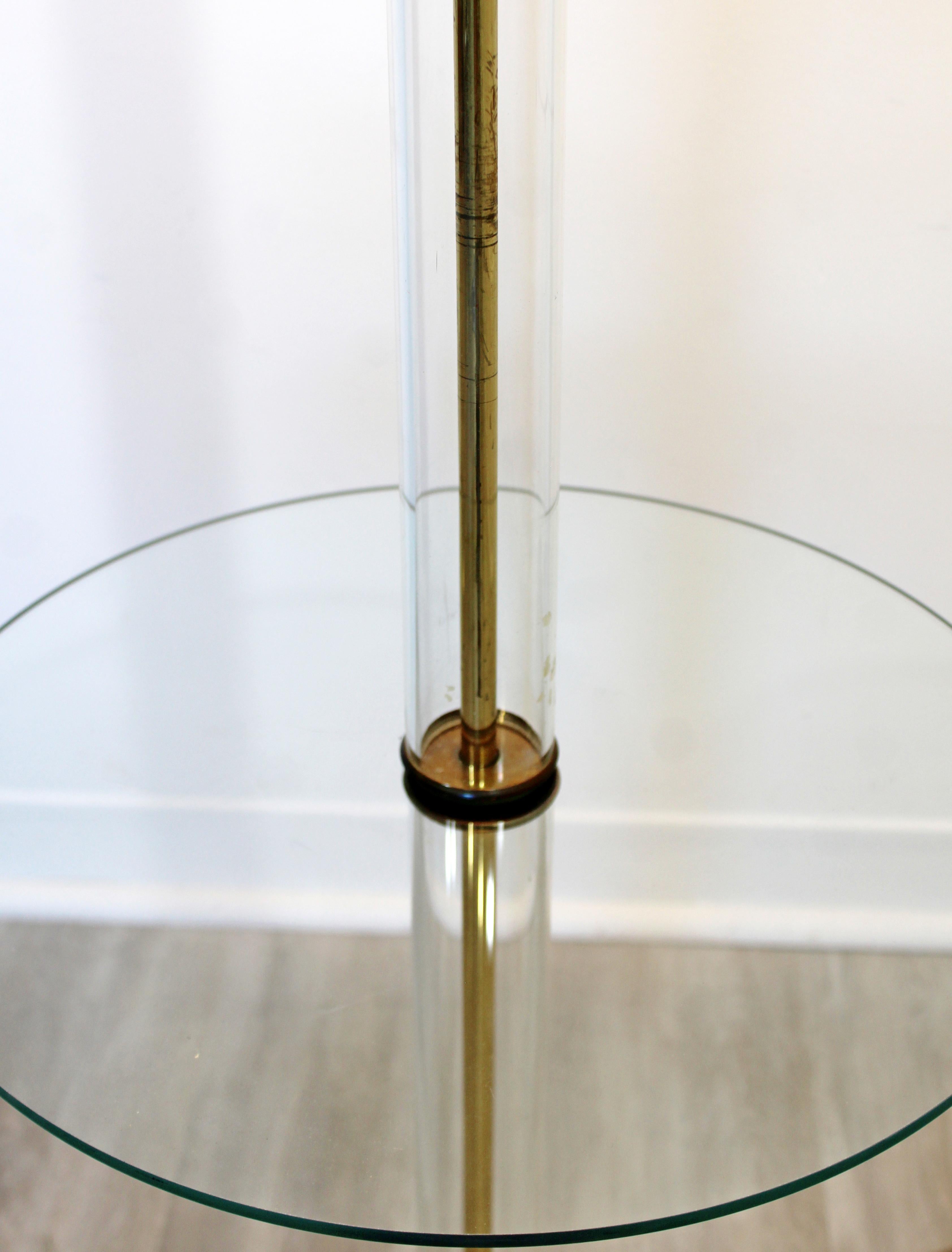 For your consideration is a fabulous, glass encased brass floor lamp, with glass table attached, with the original shade and finial, circa 1960s. In very good vintage condition. The dimensions are 19