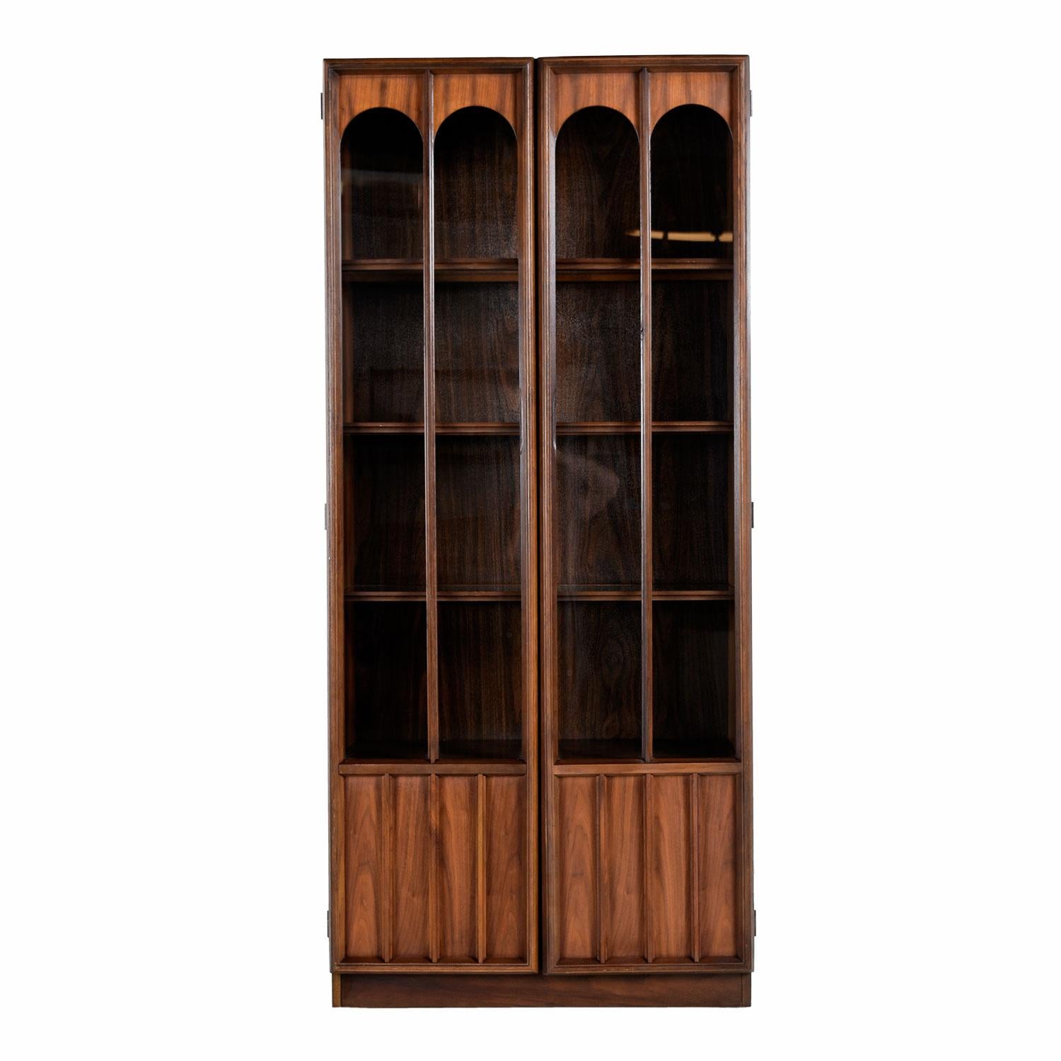 Two available and sold separately. This handsome Mid-Century Modern hutch features a glass display area and covered storage. Exhibit your collectibles or fine china in the lighted glass shelves. Figurines, glass, crystal and china will look amazing