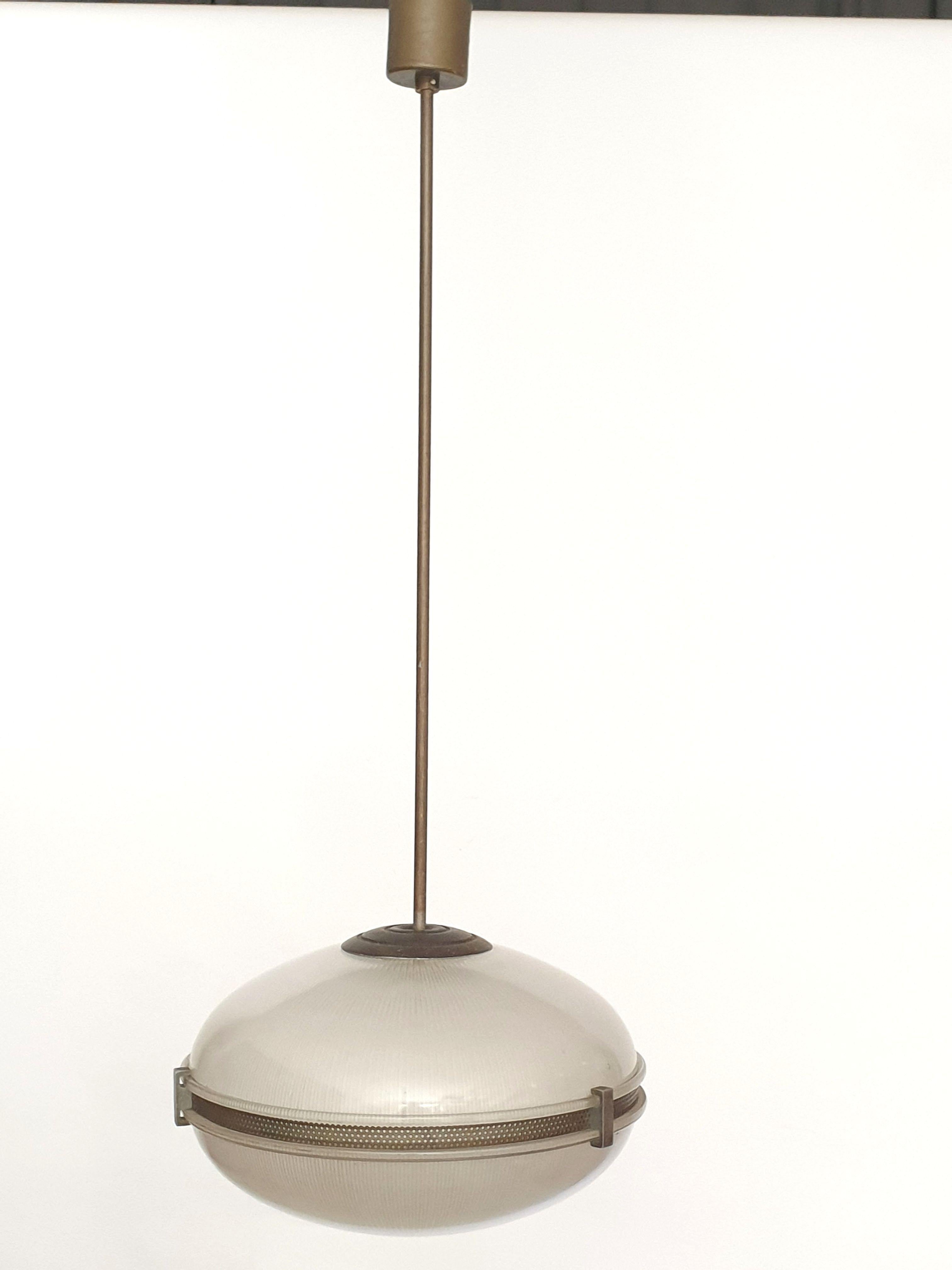 Pendant light in grey tinged glass with ribbed detail. The sections are held together with bronzed metal fixings and a bronzed perforated metal edging. There is a bronzed metal pole which could be cut if required.