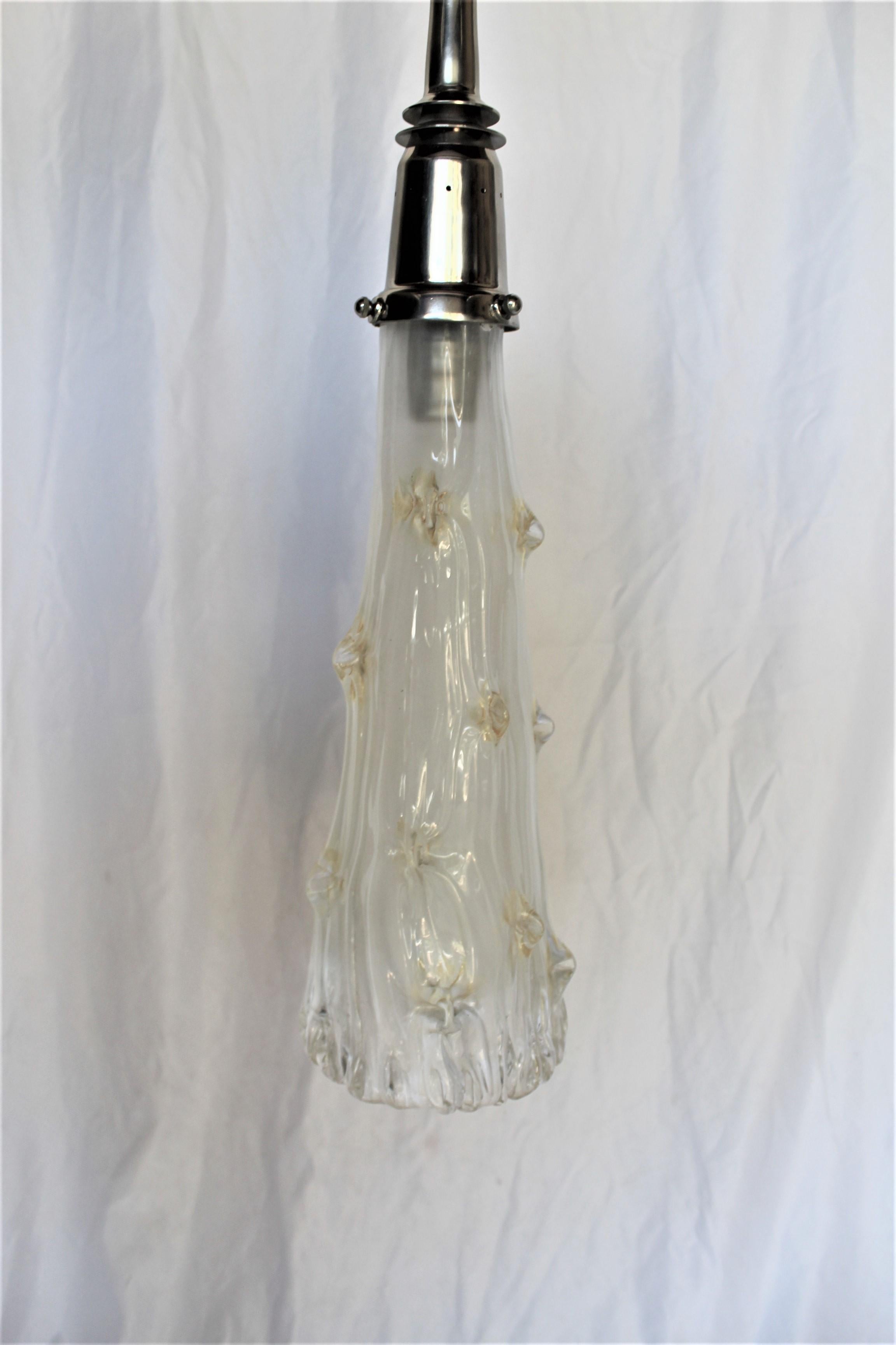 A modern custom designed Pinched glass shade with 24 K Gold dust in it. Has hi-polished Nickel metal hardware and special diamond chain. One of a kind now, no more to be made. Total drop is at 47
