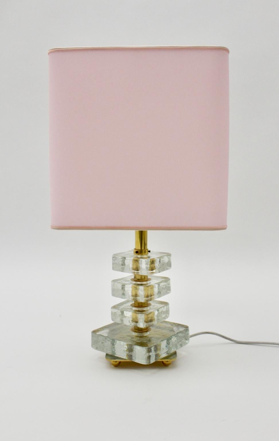 Very elegant and best quality table lamp by Bakalowits & Söhne, Vienna, 1960s.
This table lamp was made of gilded brass and four frosted glass square elements which are swiveling.
Also the golden base shows four golden balls.
This table lamp is in