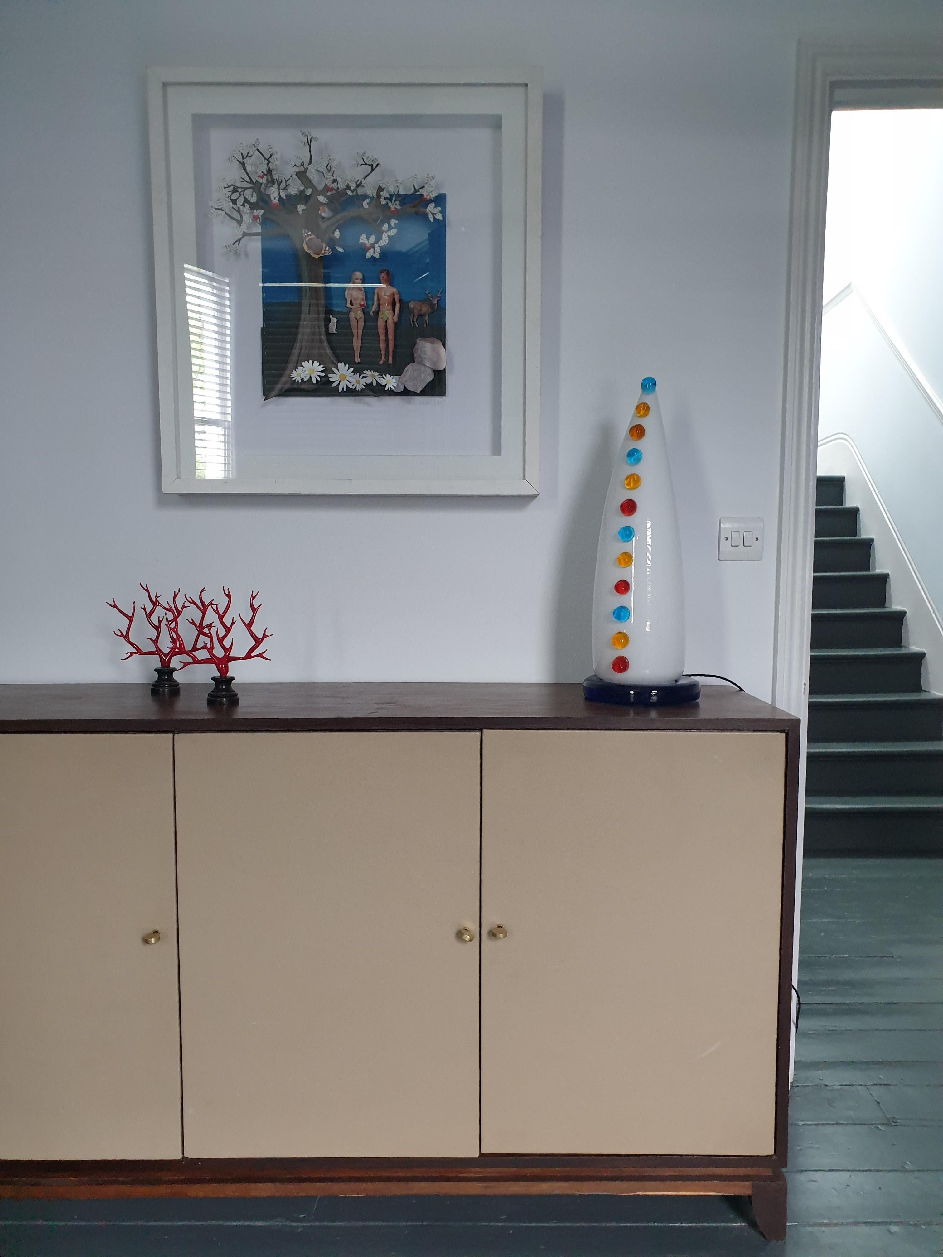 Rare large glass table lamp with unusual glass decorative details. The original glass label from Vistosi is on the base. The top lifts off from the blue glass base to change the bulb. A truly spectacular sculptural piece.