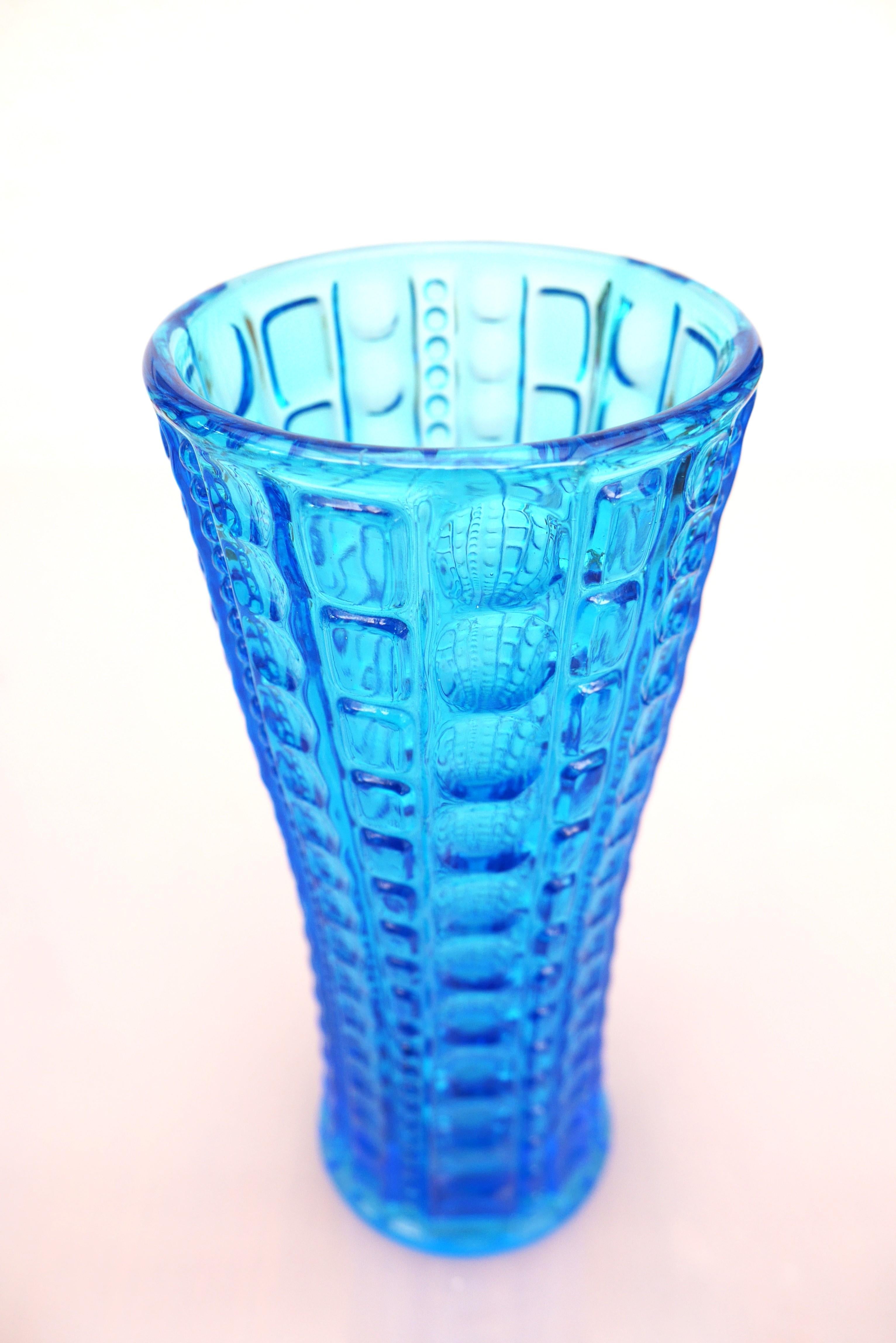An amazing vibrant blue vintage glass vase, made by Jan Sylwester Drost, Ząbkowice glass factory in Poland, the vase name is Pearl  and made in the 70s. The shape is fantastic with numerous smaller units, which together makes unique vase.

The vase
