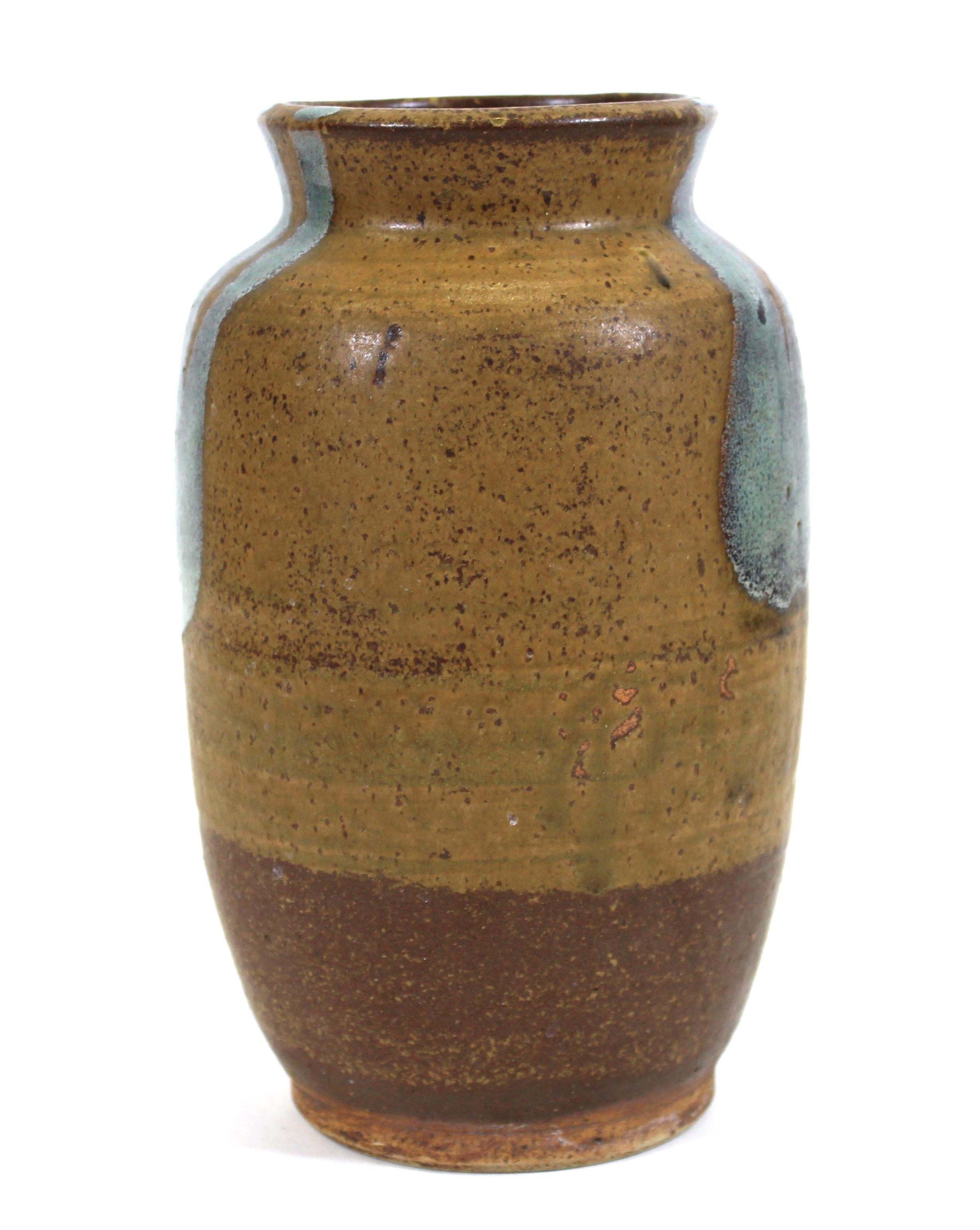 Mid-Century Modern glazed art studio pottery urn-shaped vase in brown tones with greenish accents, unsigned.