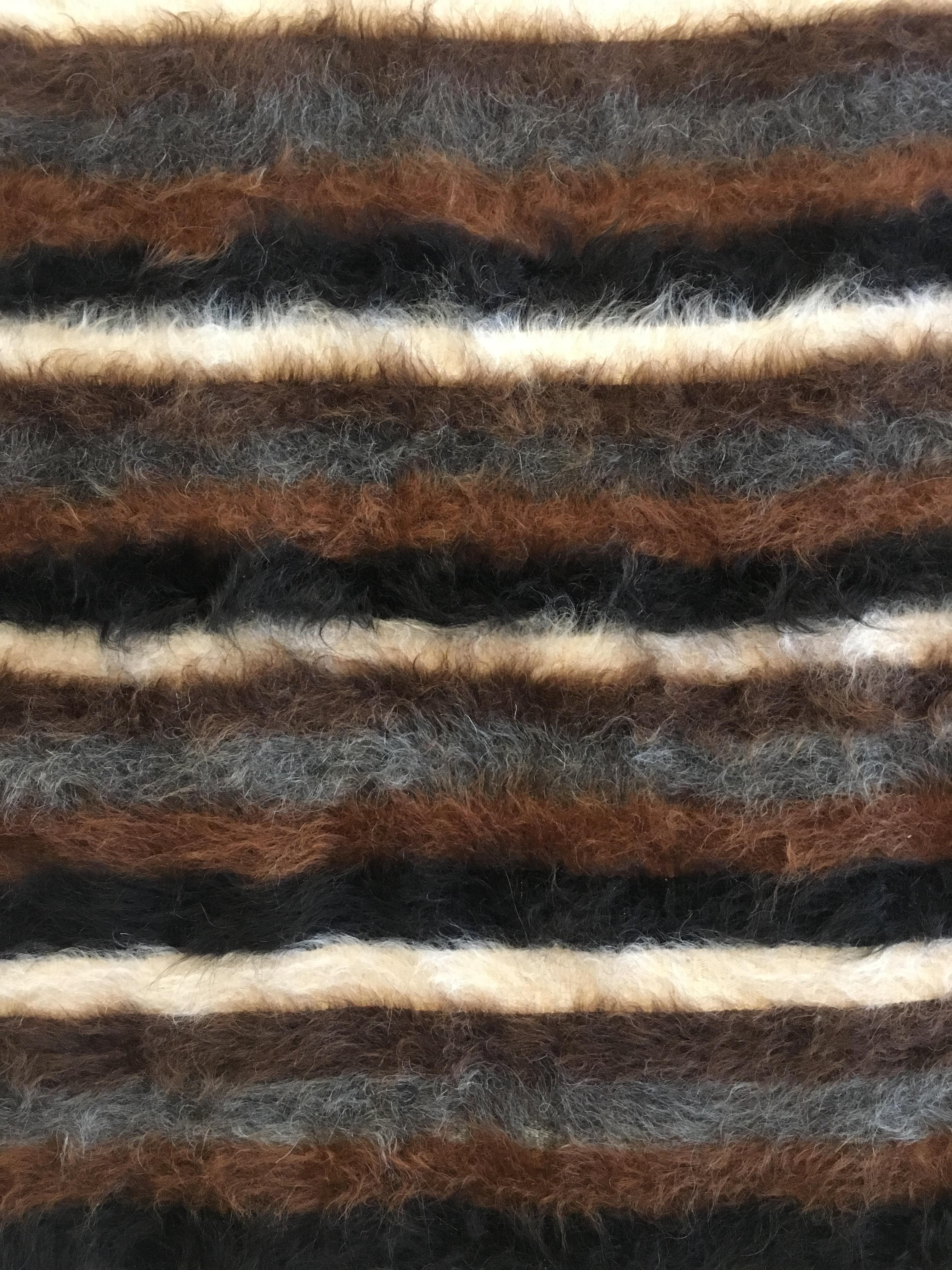 Handwoven in eastern Turkey, mid-20th century, this small rug has a cotton foundation and a woven soft goat hair pile using all natural, undyed colors of black brown and ivory. In excellent condition, with a truly great look.
