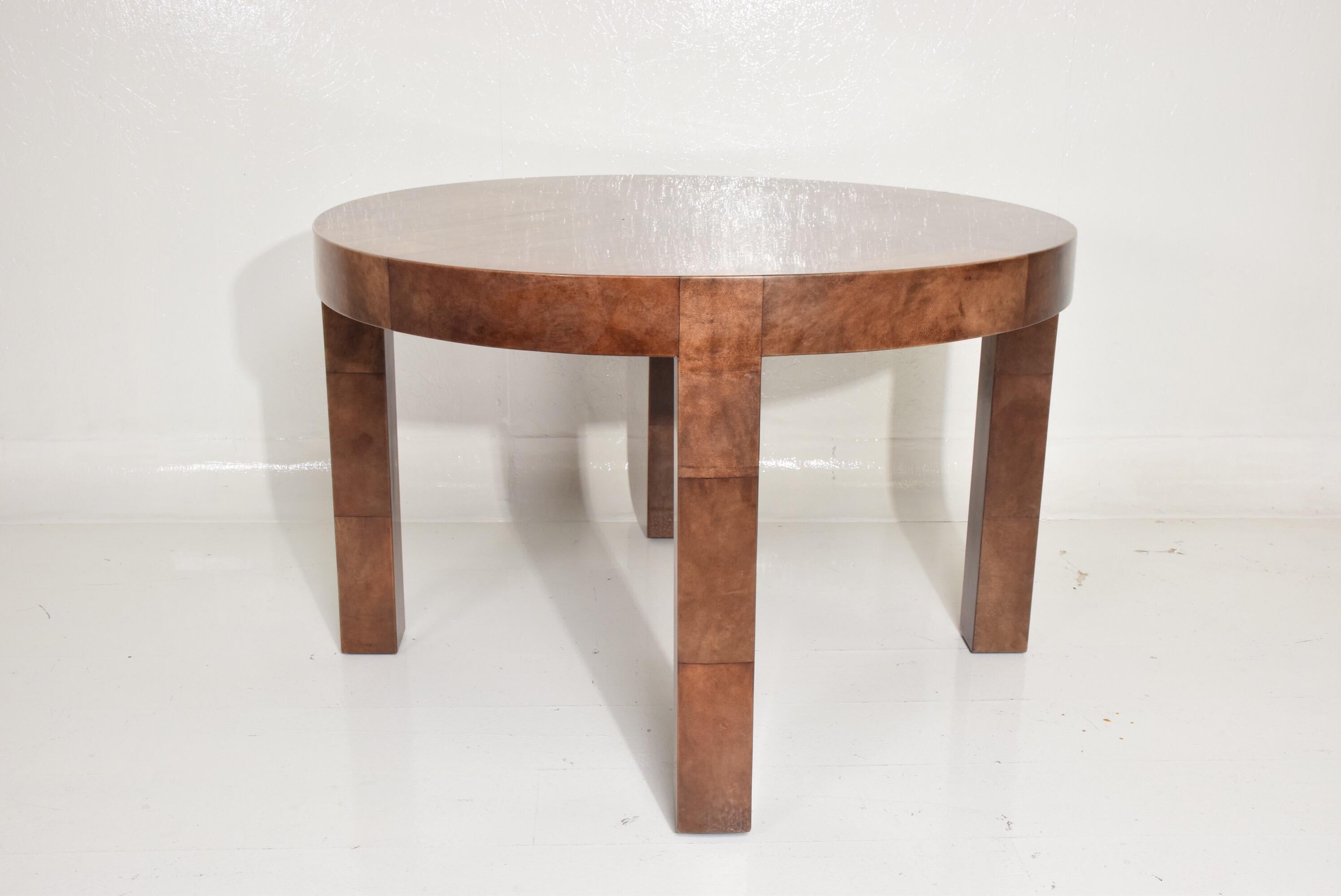 For your consideration, a Mid-Century Modern goatskin wrapped dining table in brown tones.
Unmarked, unsigned. 

Dimensions: 47 1/8