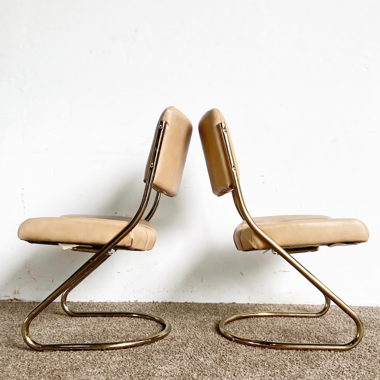 Elevate your decor with our Mid Century Modern Cantilever Chairs by Chromcraft. Their gold frames and tan upholstery offer an inviting, vintage look.

Pair of Mid Century Modern Cantilever Chairs by Chromcraft.
Features gold frames for a vintage,