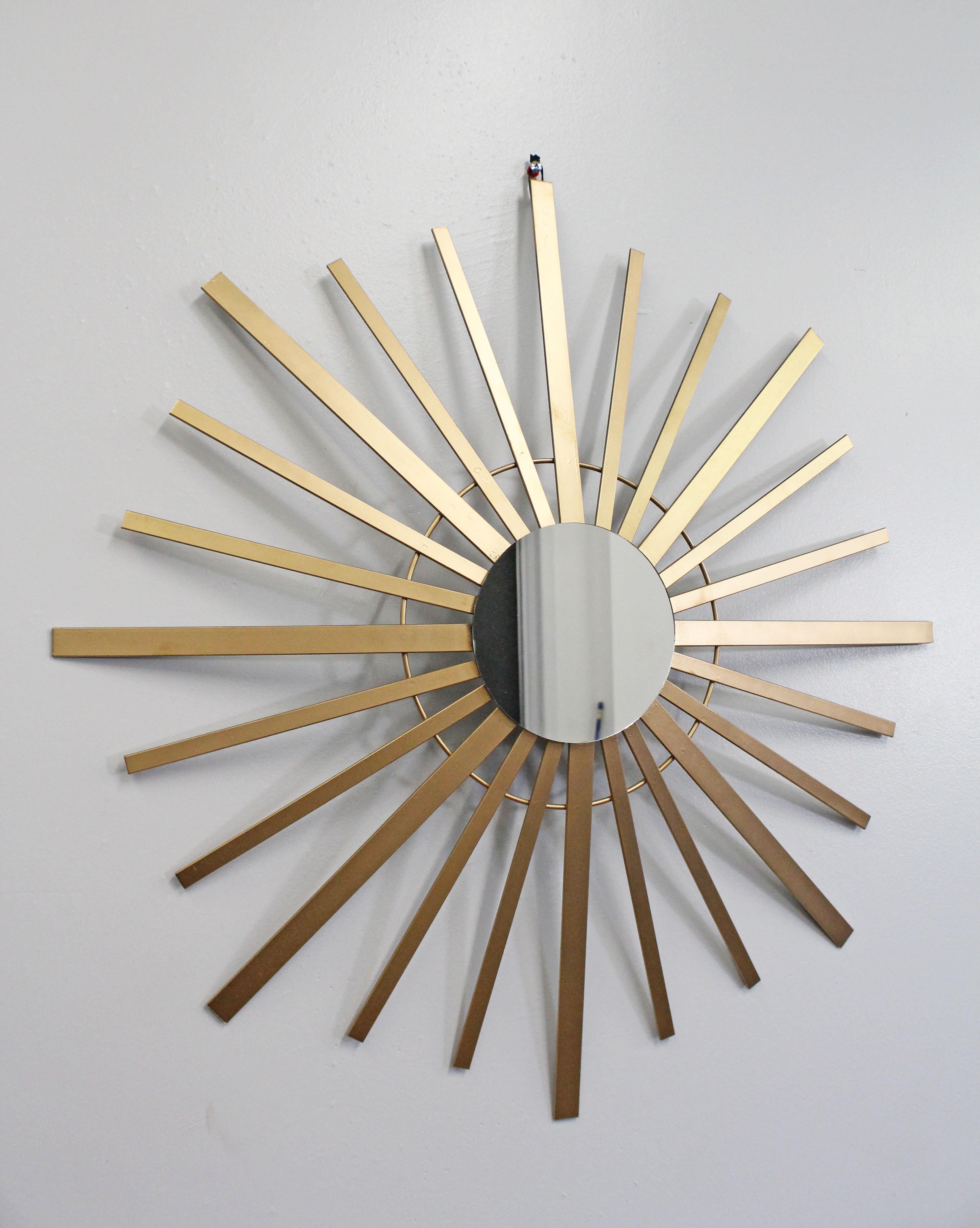 Offered is a super unique, vintage mid-century wall mirror in the shape of a 