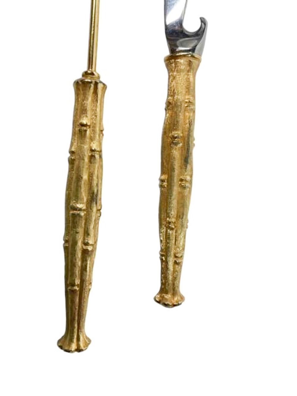 Mid Century Modern bar tools by Napier, a bar knife and stir spoon each with weighted gilt handles formed as bundles of bamboo.