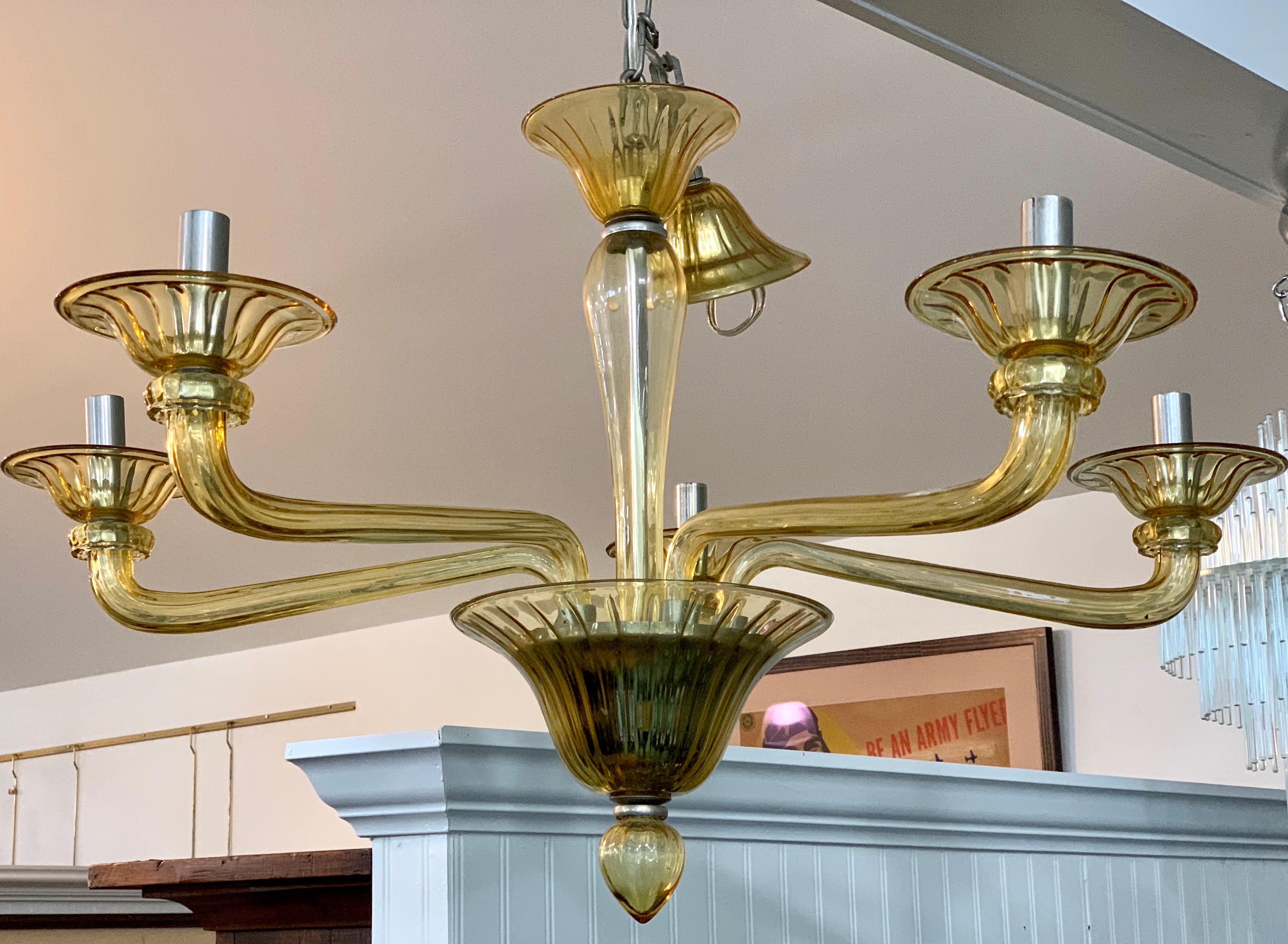 Elegant, Mid-Century Modern five-arm Murano glass chandelier. Wired for USA and in perfect working order. Now, more than ever, home is where the heart is. Made in Italy.