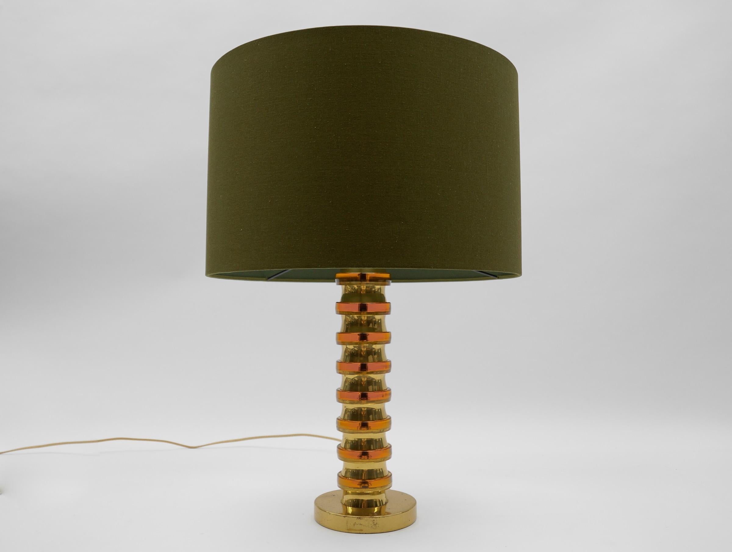 Mid Century Modern Gold Orange Swirls Table Lamp Base, 1960s Germany

The lampshade is to illustrate how the lamp base looks with a shade. The shade has a diameter of 17.71 in. (45 cm) and height 11.41 in. (29 cm).

One E27 socket. Works with 220V