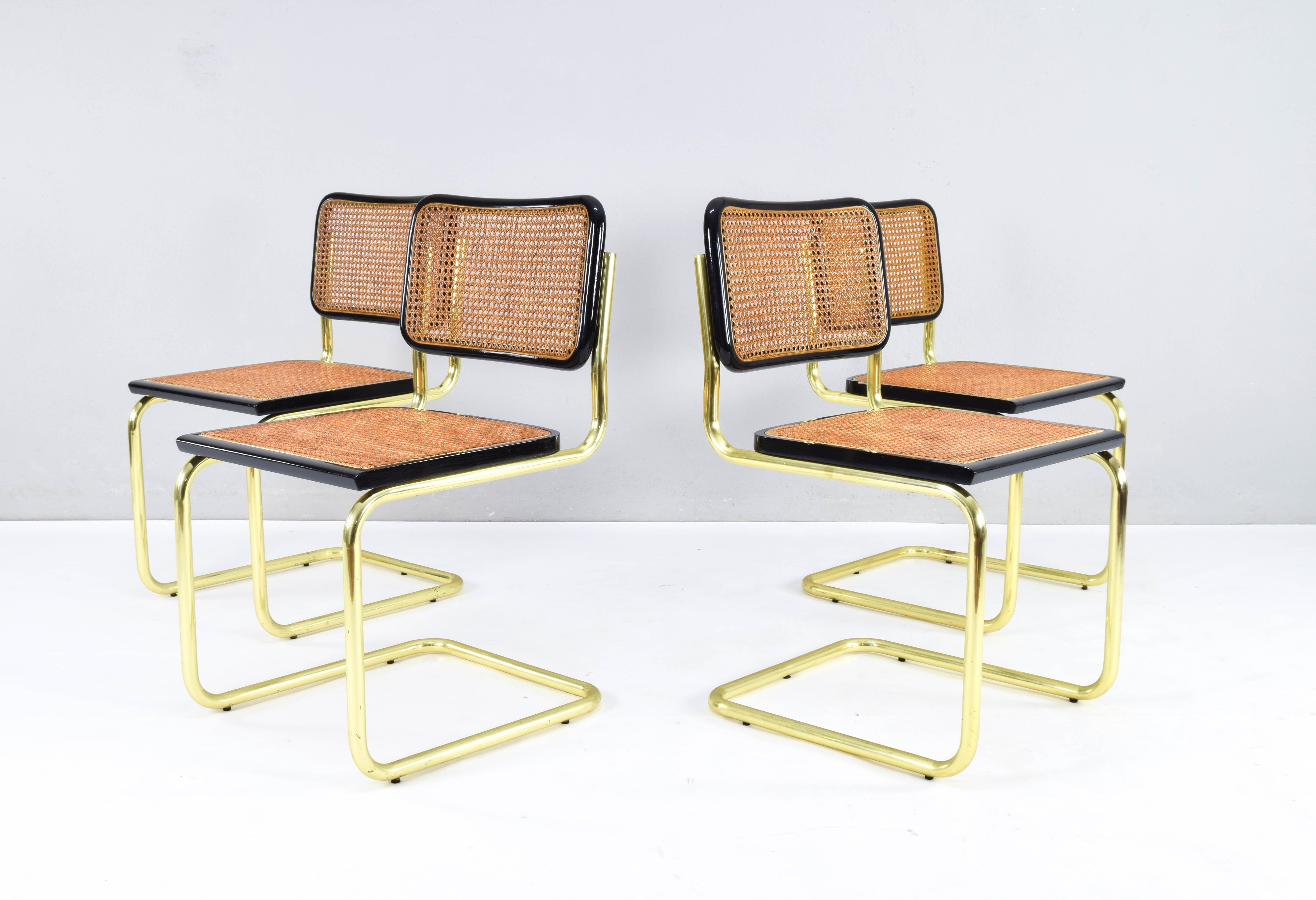 Set of four Cesca B32 model chairs. Tubular brass structure, beech wood frames lacquered in black and Viennese natural grid. The grids of the seats are newly placed.
The brass has typical wear areas of these parts but in general they are in very