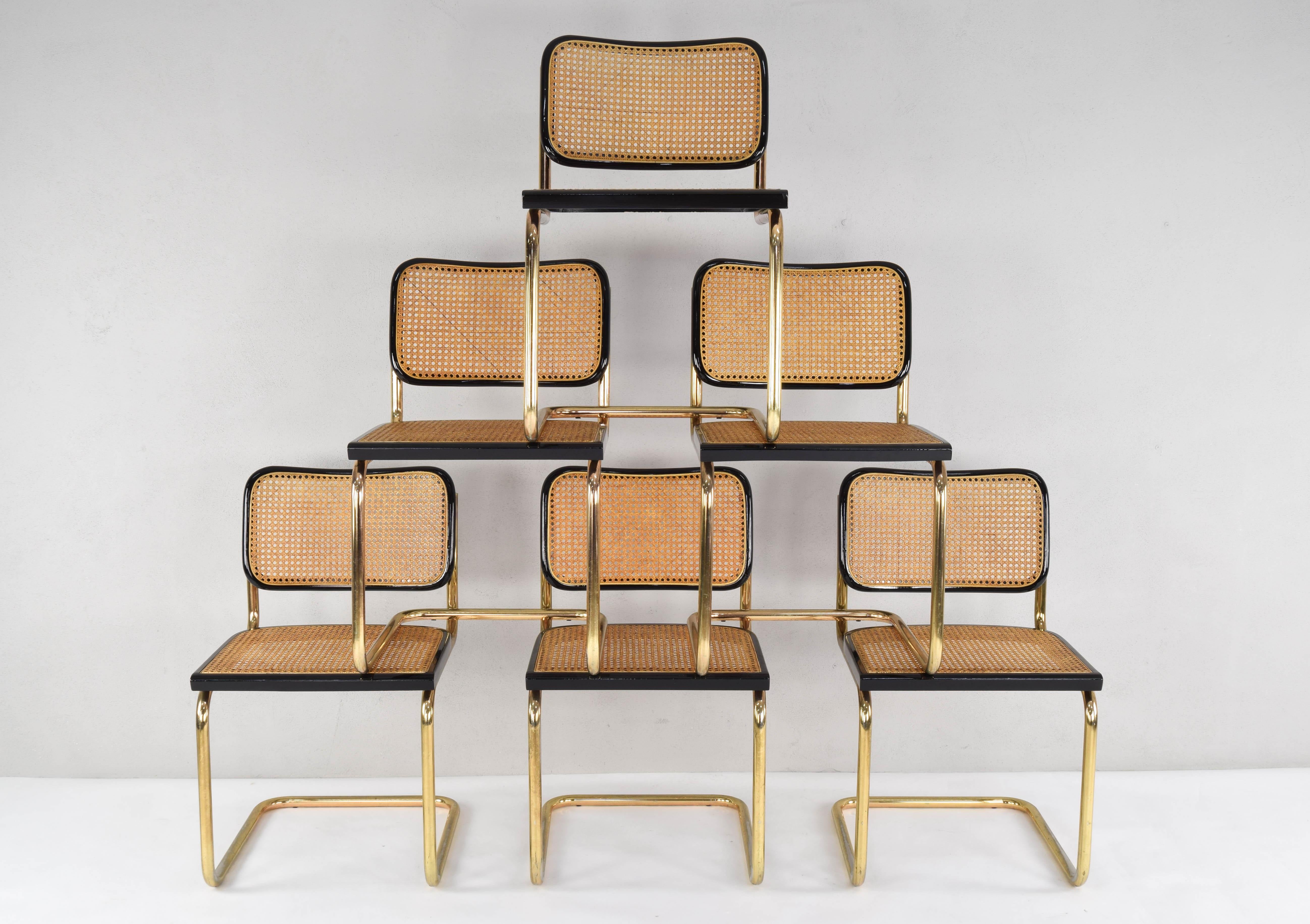Set of six Cesca B32 model chairs. Tubular brass structure, beech wood frames lacquered in black and Viennese natural grid. The grilles of the six seats are newly placed.
The brass has typical wear areas of these parts but in general they are in