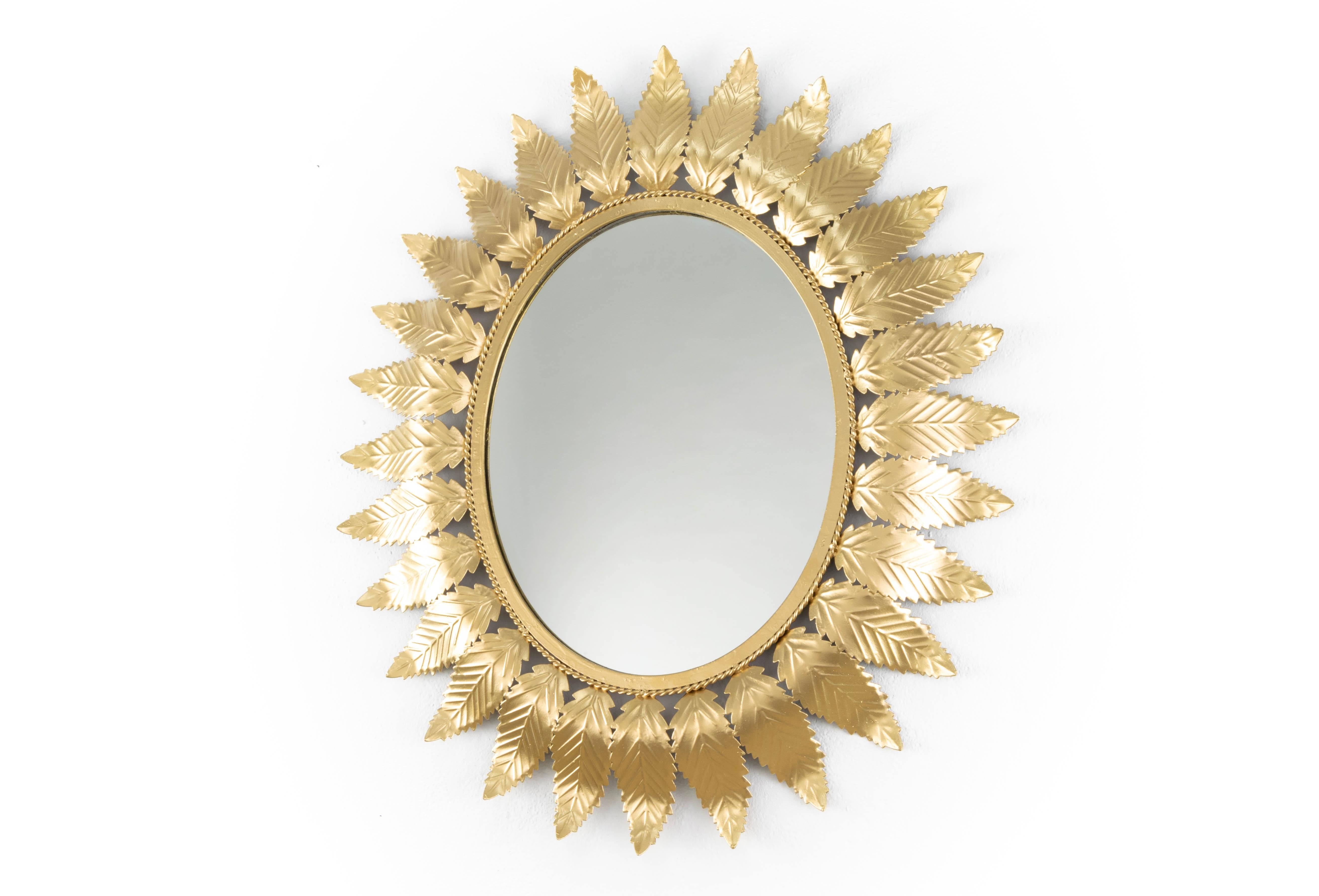 Metallic mirror with gold finish in the form of sun, 1970s`
Measurements:
Total height 77 cm
Width 67 cm.
