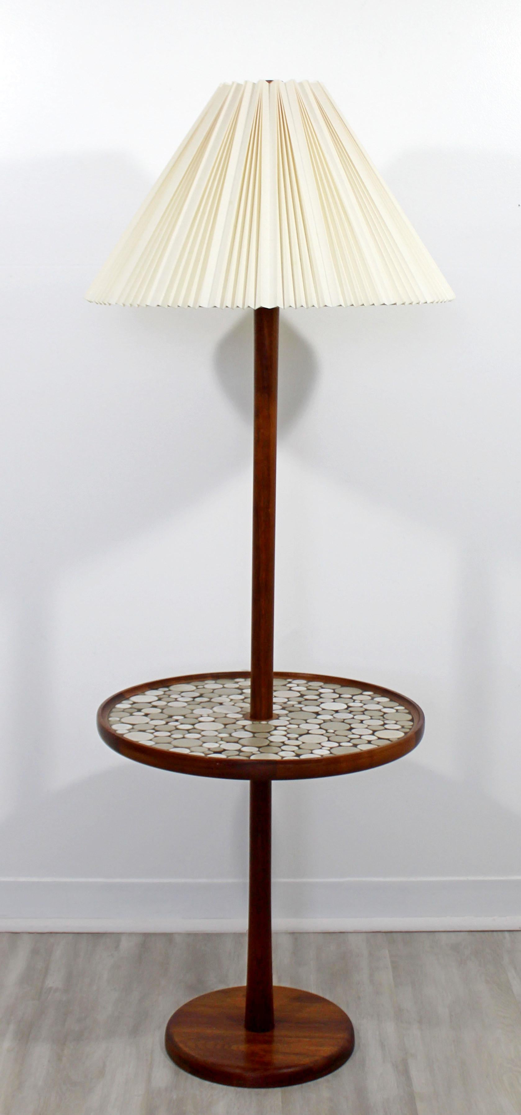 For your consideration is a magnificent, walnut wood floor lamp, with an attached tile table that's made of pottery circles, by Gordon & Jane Martz for Marshall Company. Original shade and wood finial. In excellent condition. The dimensions are 21