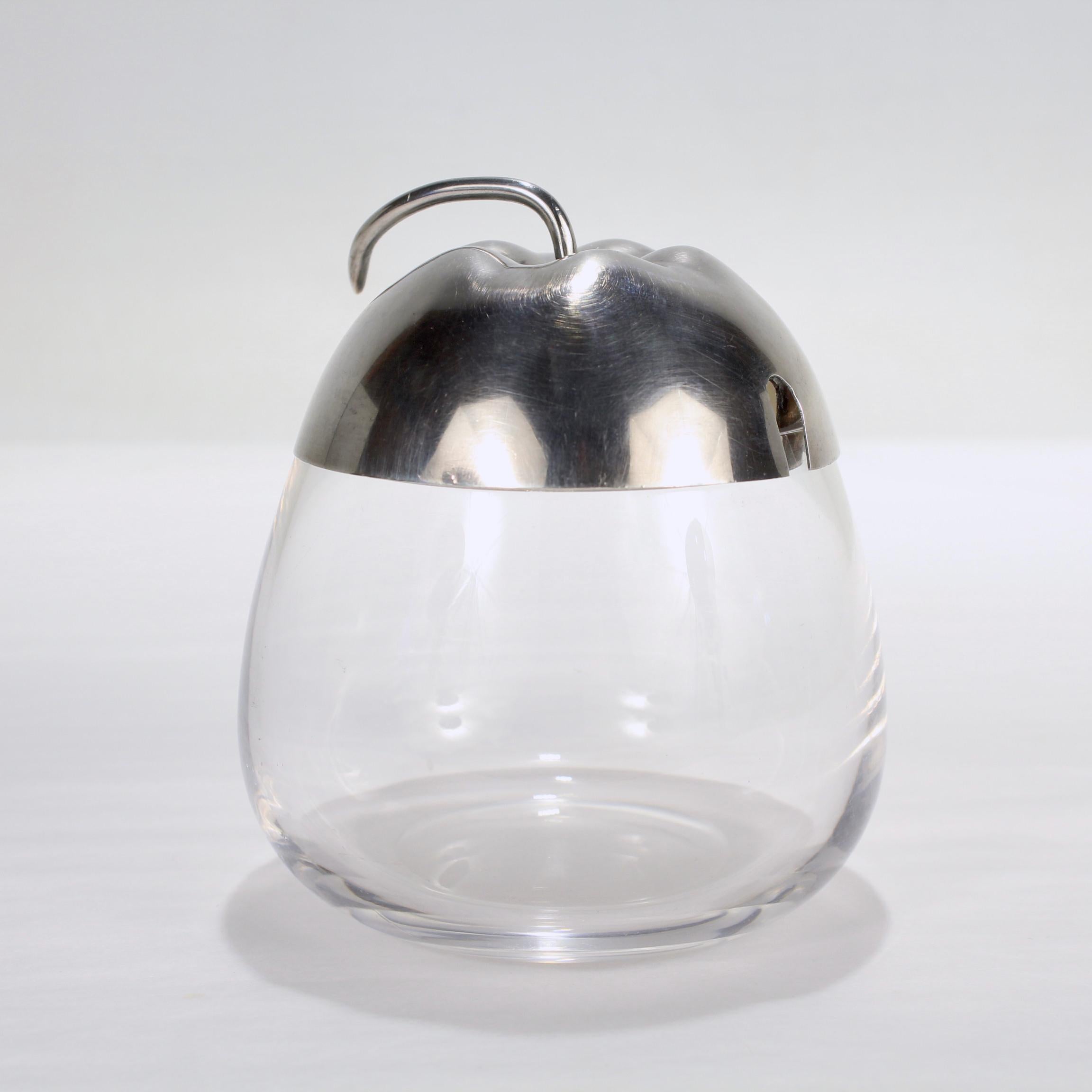 A fine Mid-Century Modern sterling silver & glass jam or honey pot.

By Gorham.

In the form of a pear. 

Simply a great jar!

Date:
Mid-20th Century

Overall Condition:
It is in overall good, as-pictured, used estate condition.

Condition