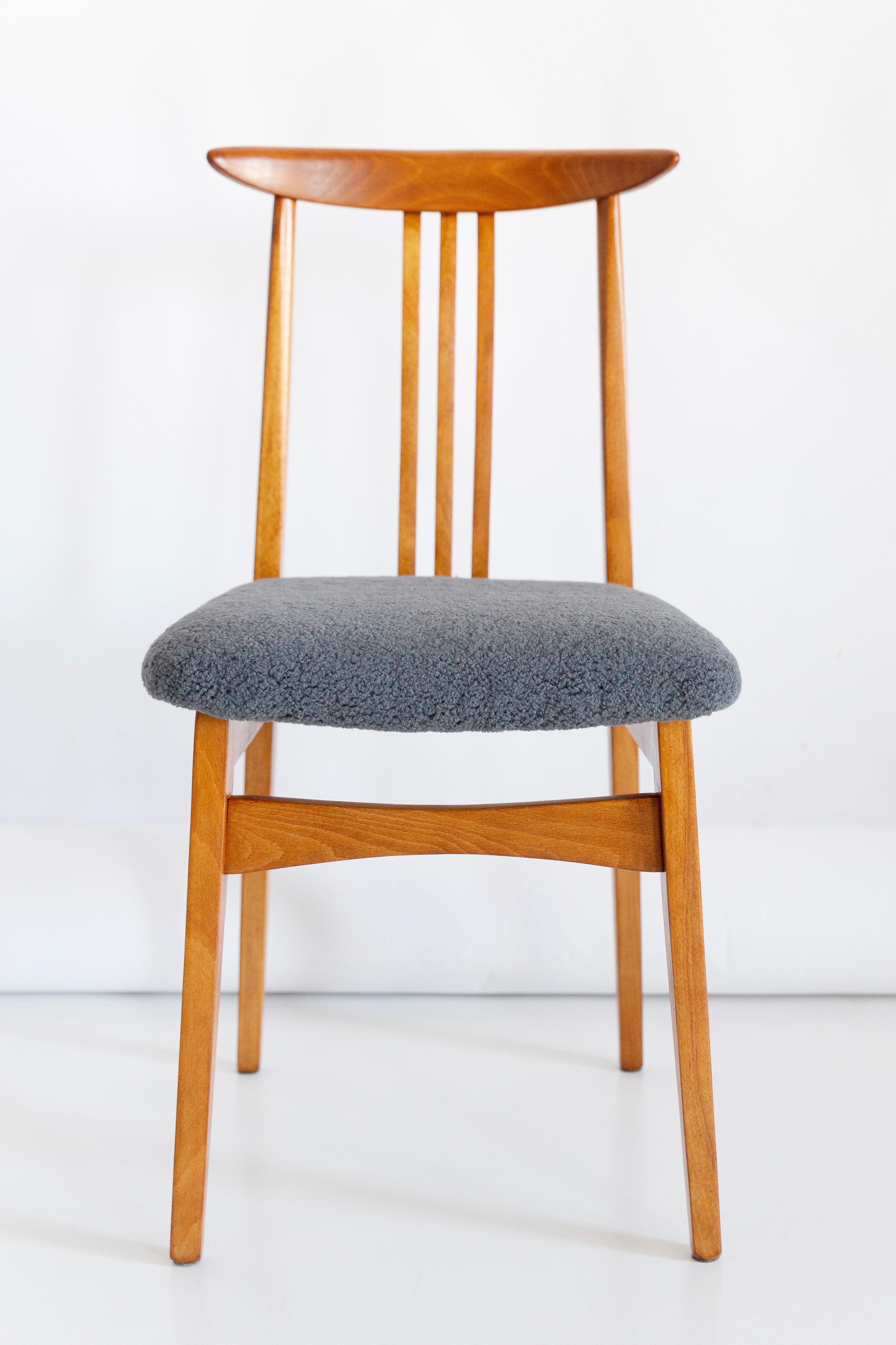 A beautiful beech chair designed by M. Zielinski, type 200 / 100B. Manufactured by the Opole Furniture Industry Center at the end of the 1960s in Poland. The chair is after undergone a complete carpentry and upholstery renovation. Seats covered with