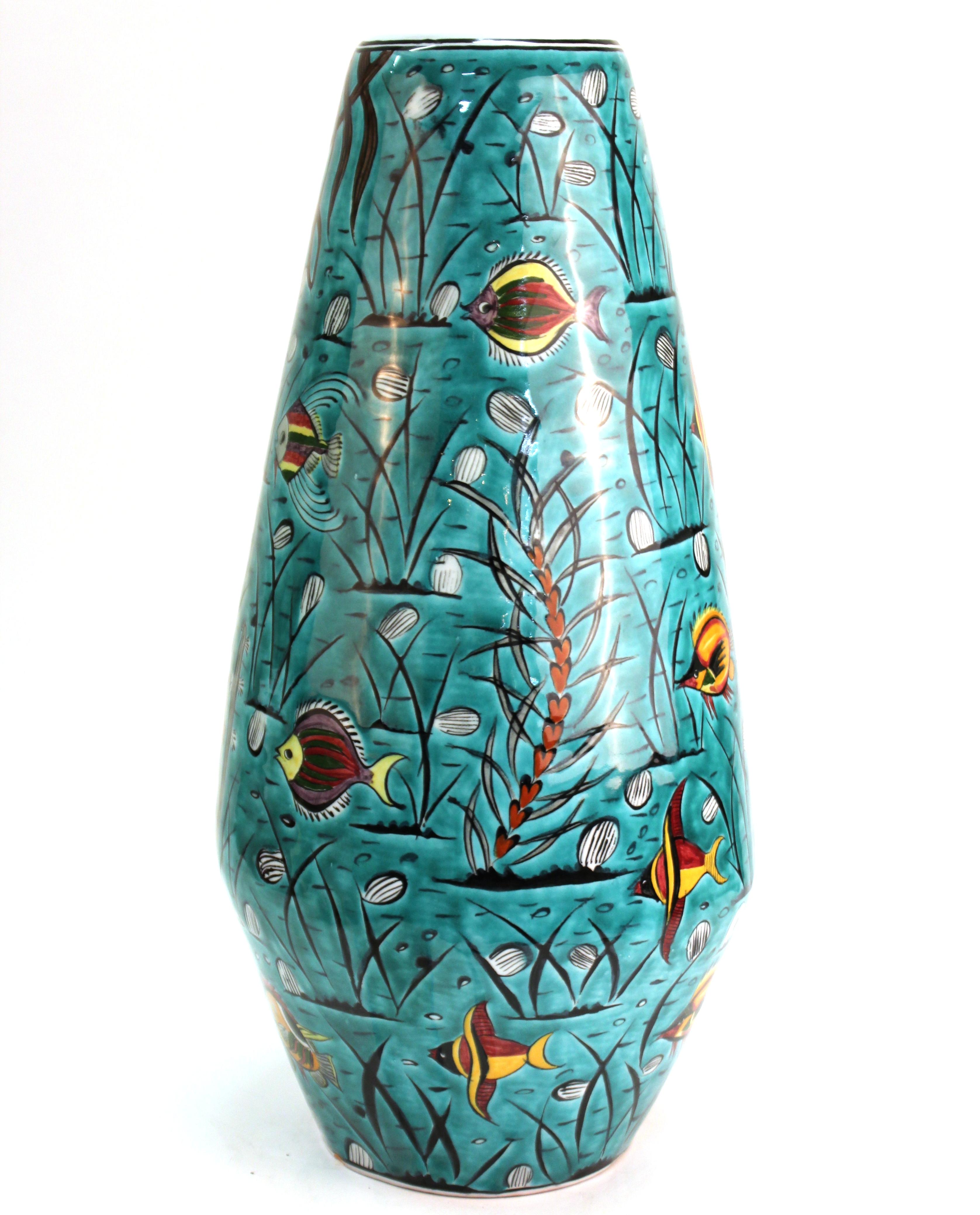 Greek Mid-Century Modern pottery vase with hand painted aquatic theme featuring fish and water plants. The piece is signed on the bottom 