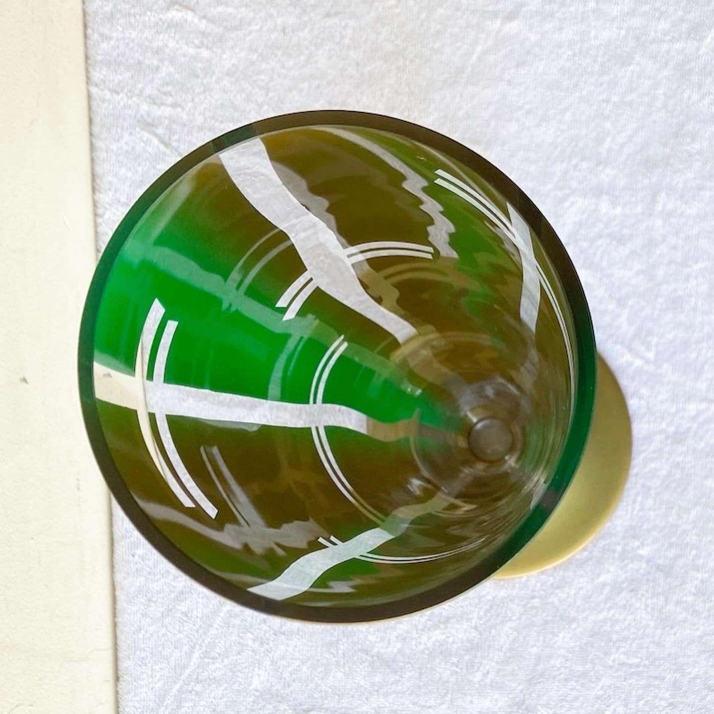 Wonderful vintage mid century modern glass vase. Features a painted green and gold finish.
