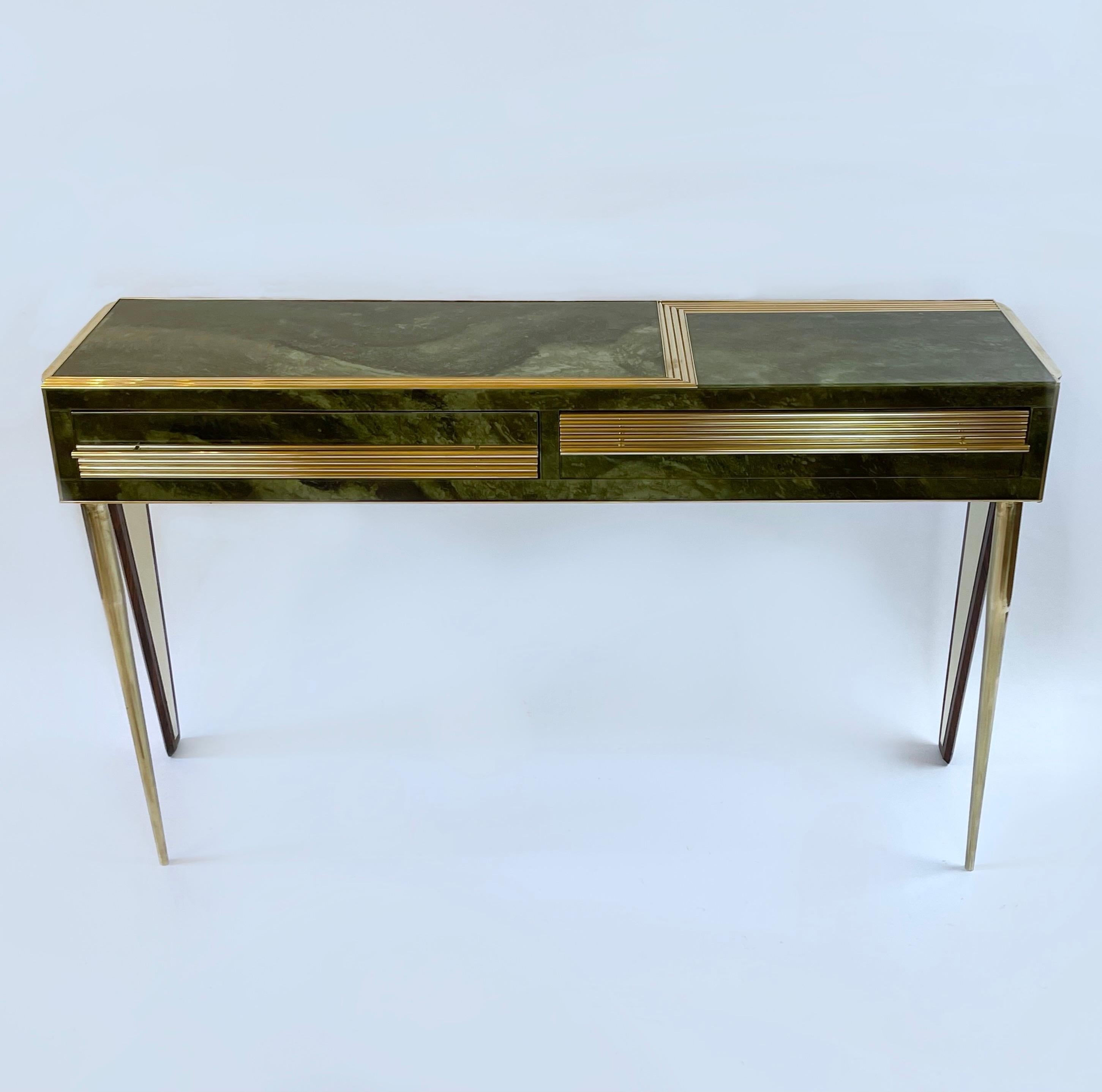 Two drawers with green velvet inside.
The depth of 39 cm is including the brass handle.