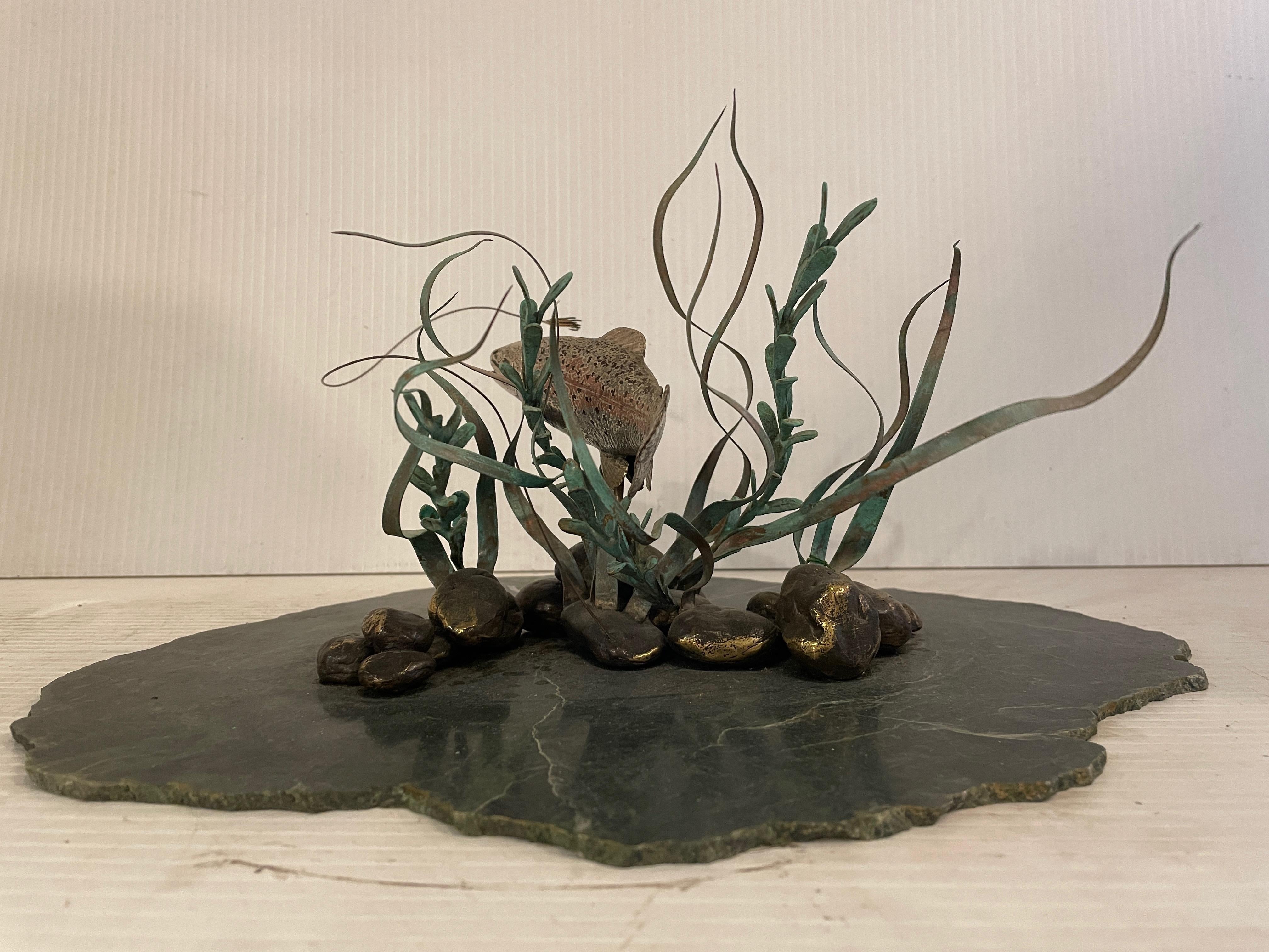 Very unique vintage modern sculpture features a bronze fish swimming through a field of seaweed on a green marble base. This truly one of a kind sculpture would make a great centerpiece in any home.

Please confirm item location NY or NJ with