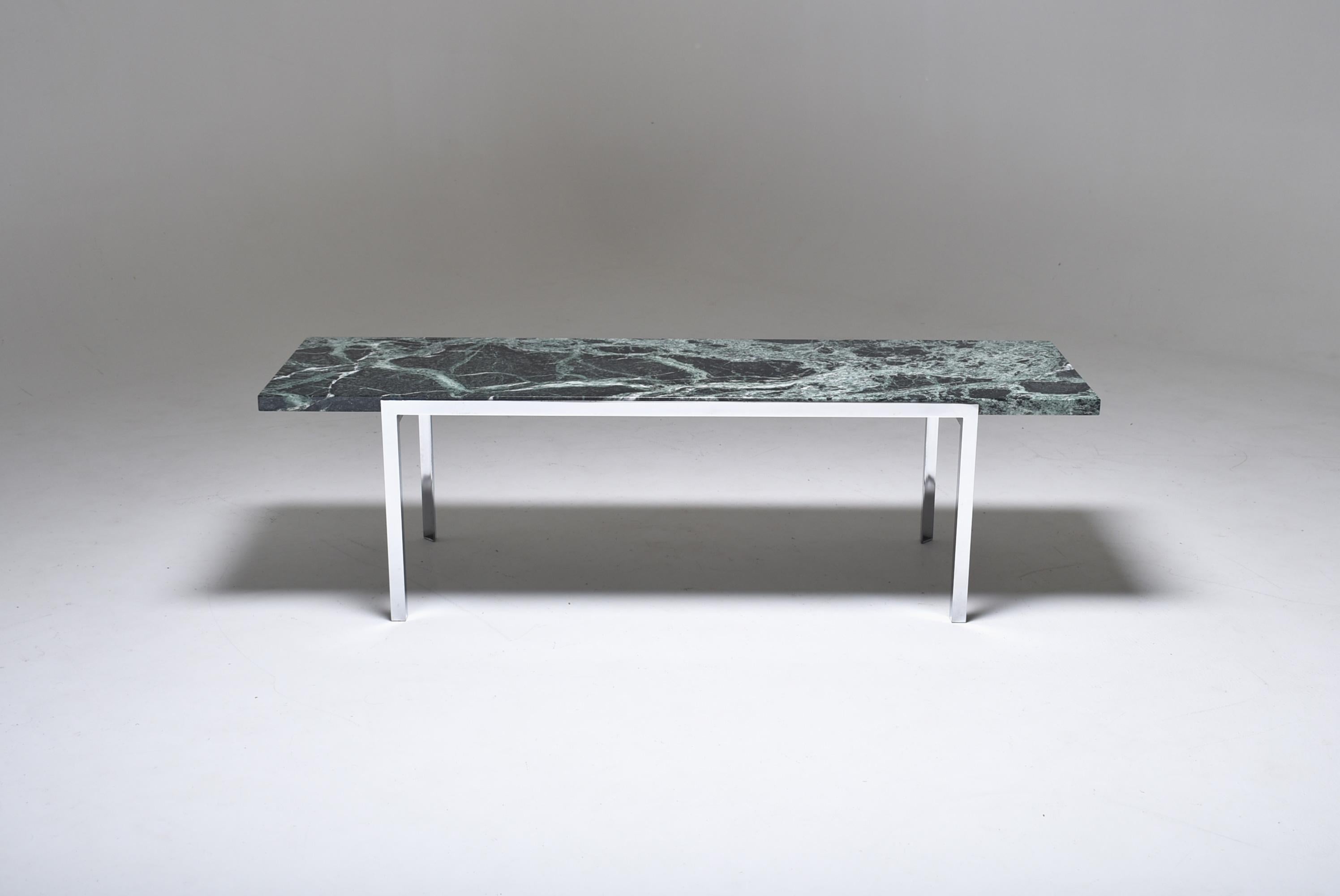 Well proportioned coffee table, with a top of Alpi Verde marble sitting on chrome structure.
Elegant fitting, the top seems to float over the legs.
Beautiful green marble from the Alps, with nice patterns.
The top is in excellent condition, and