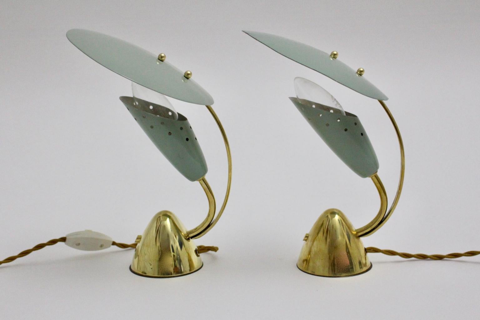 This pair of charming pistachio green bedside- or table lamps by Arredoluce, Italy, features a diffuser.
The bedside lamps were made of brass, pistachio green and white lacquered metal and brass details.
The original condition is very good with