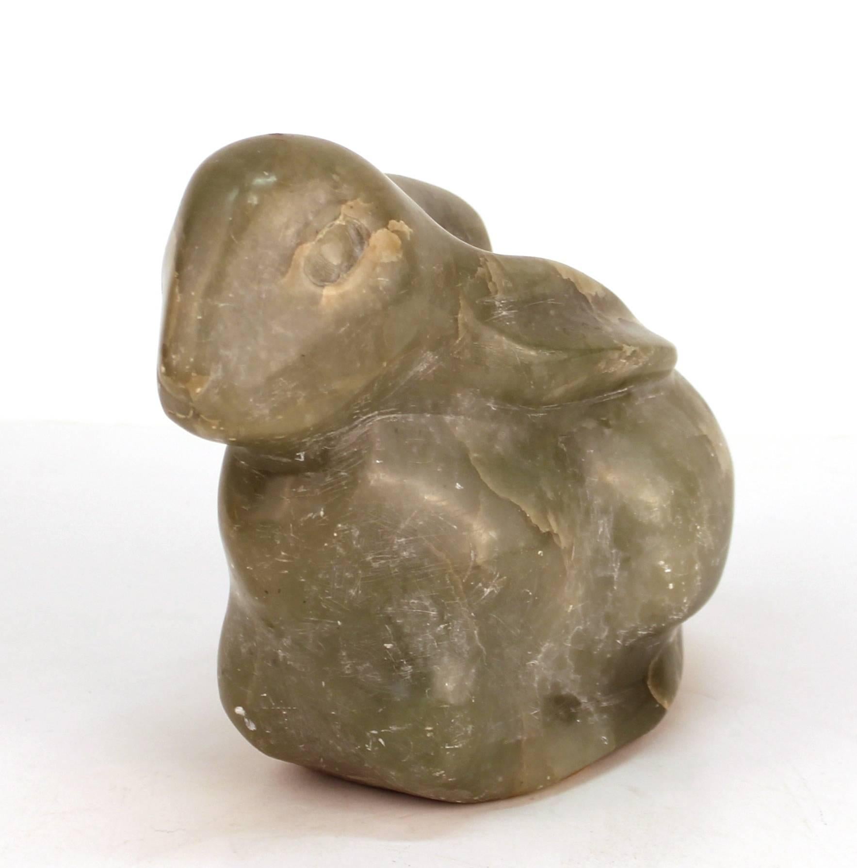 A Mid-Century Modern sculpted figure of a rabbit, made of green quartzite. The piece is unsigned and in good vintage condition with age appropriate wear and use.