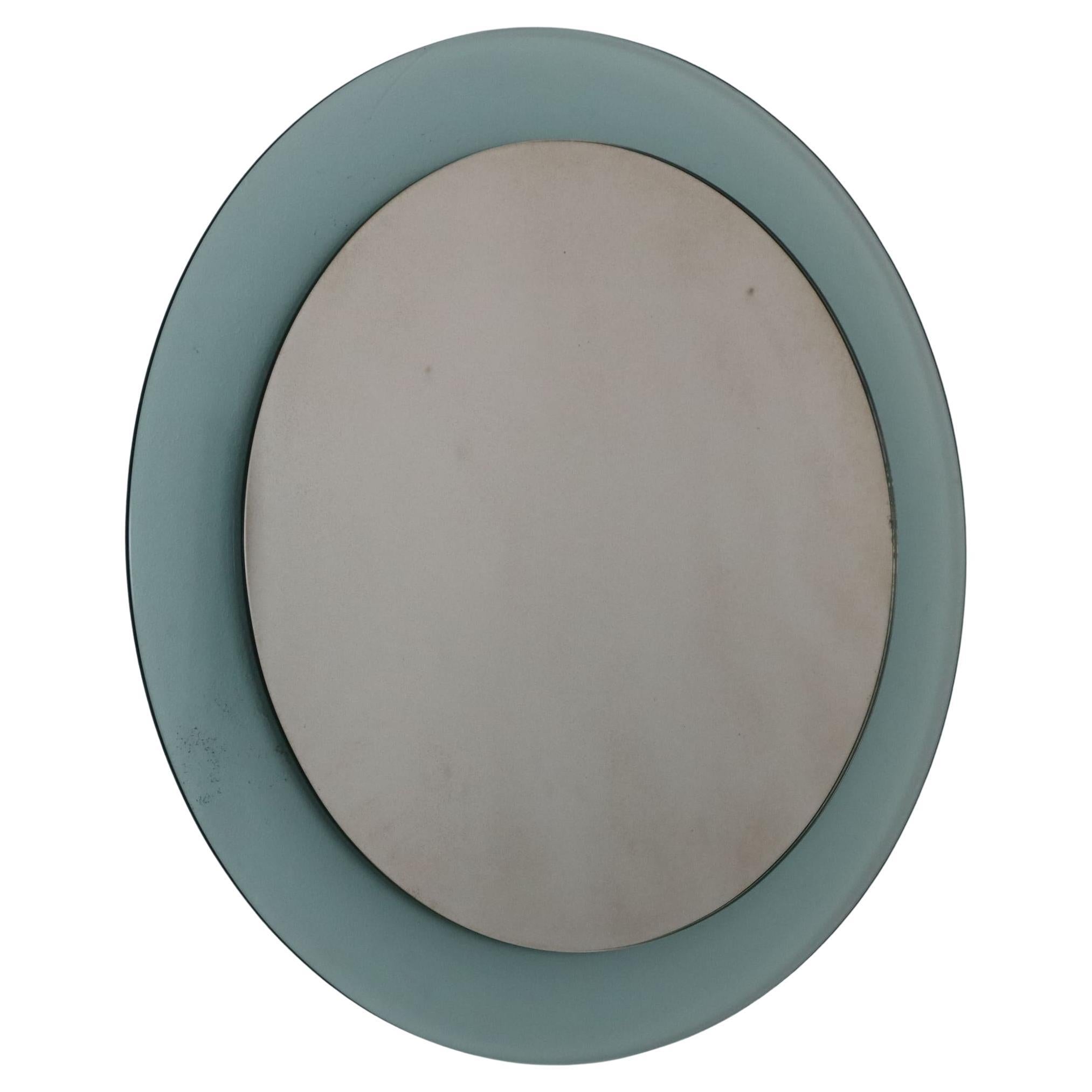 Mid-century modern green round mirror by Veca, Italy, 1970s

This elegant mid-century modern mirror by Veca is a stunning example of Italian design from the 1970s. Featuring a round Murano glass border in a distinctive Nile green color, it exudes