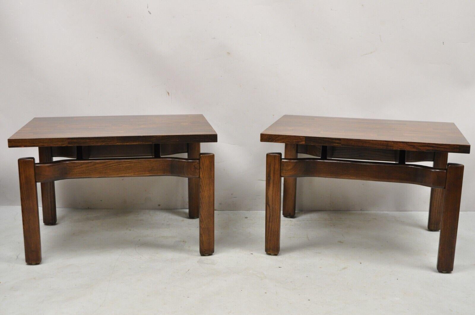 Mid Century Modern Greta Magnusson Grossman Low Side End Tables Laminate - Pair. Item features laminate tops, solid oak wood sculpted base, low sleek form, very nice vintage item, great style and form, design attributed to Greta Magnusson Grossman.