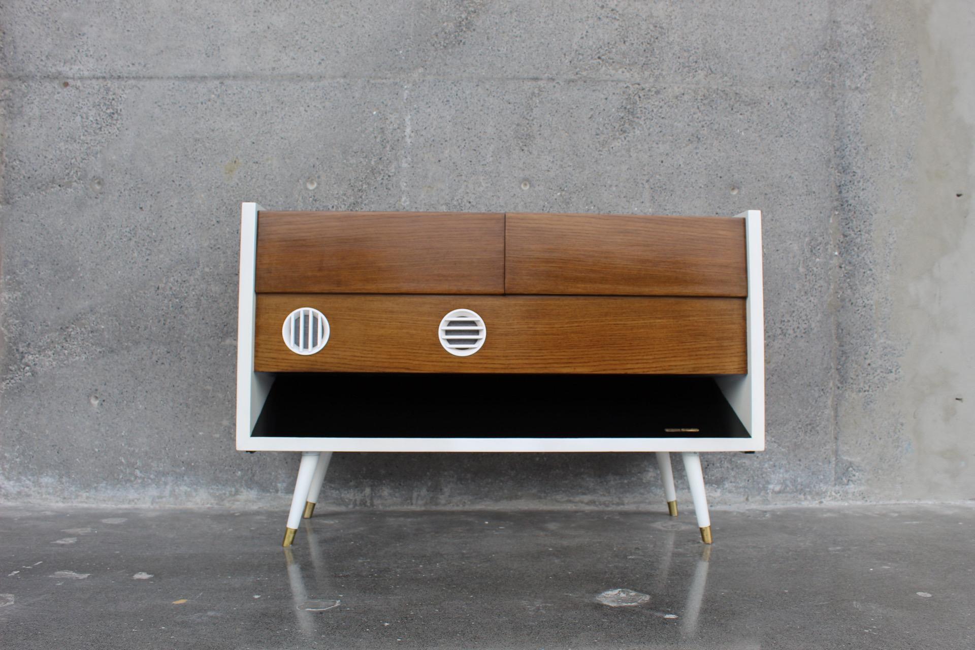Spectacular mid-century console made in Germany model 8080/USA. We added new Bluetooth audio equipment as the original system we believe does not work. The entire exterior and interior was professionally restored.