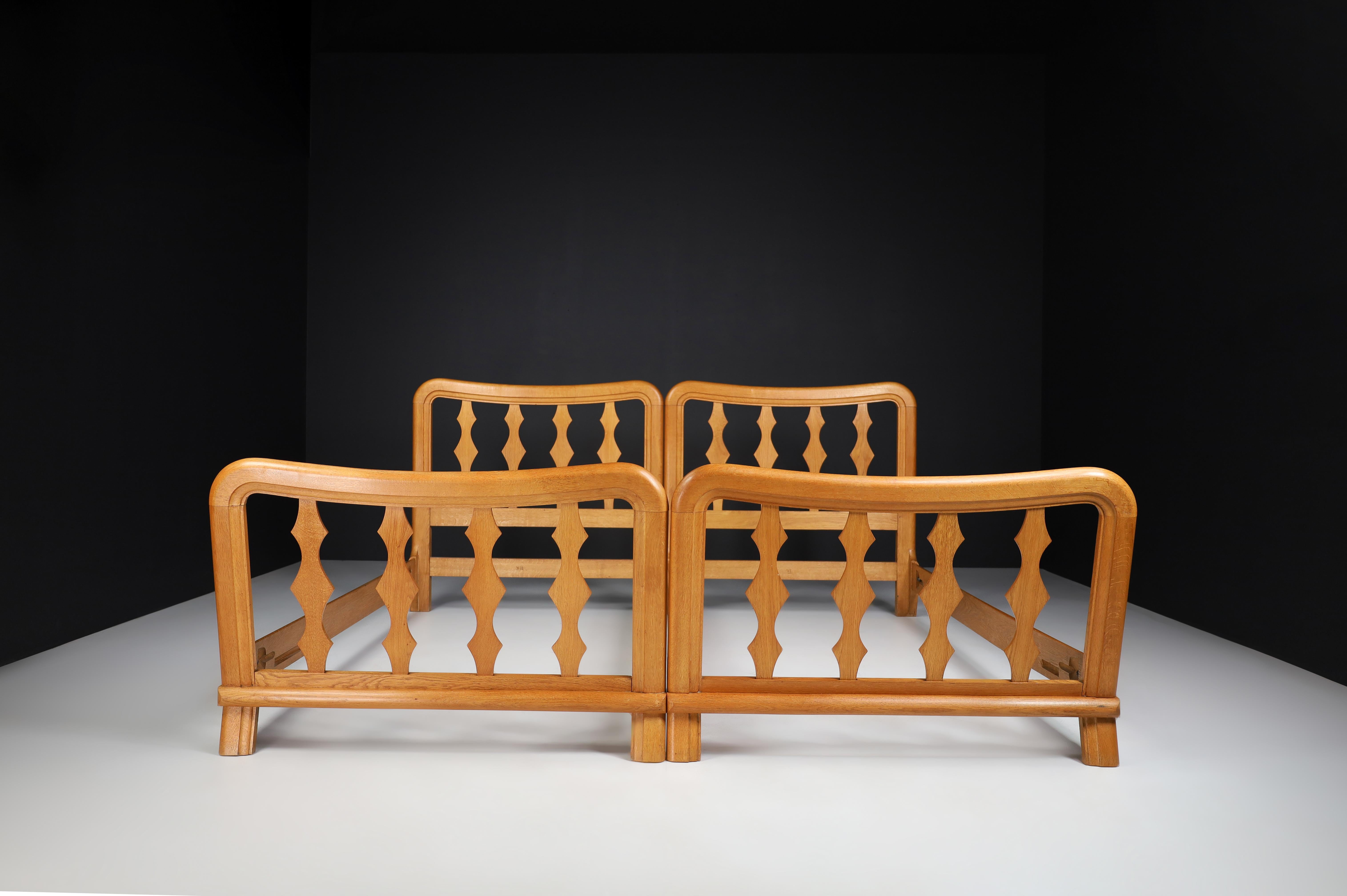 Mid-Century Modern Guillerme & Chambron Bed in Solid blond Oak, France 1960s

This beautiful bed was made in France in 1960 and has a crafted oak frame with gorgeous sculpted detailing on the slats. Note priced per single bed.

The company,