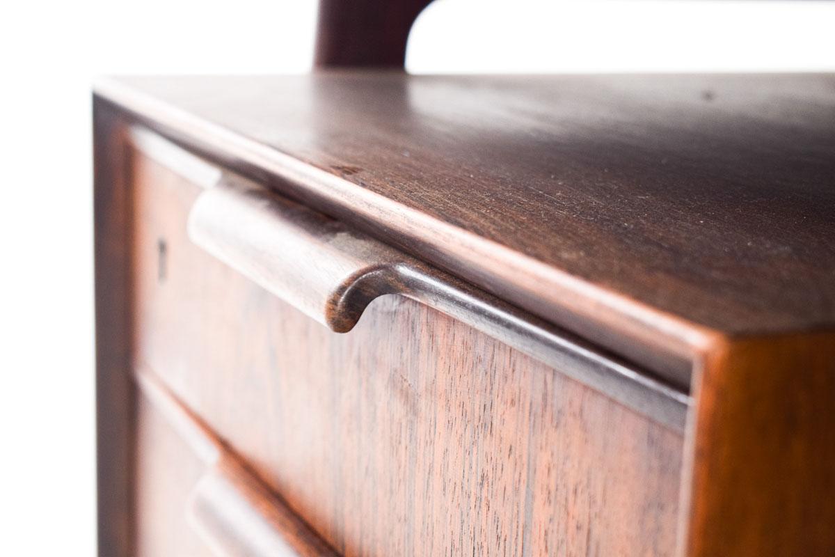 Mid-Century Modern rosewood desk, designed by Gunni Omann for Omann Jun Mobelfabrik, Denmark, 1960s. With three drawers on each side at the front, a door and two shelves at the back.